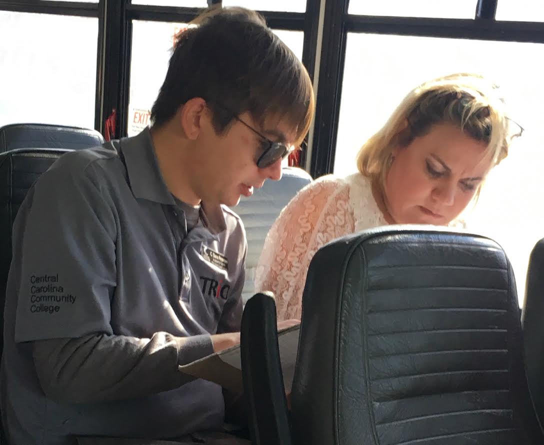 A TRiO coach and a student study for an upcoming math exam on the way to Boone