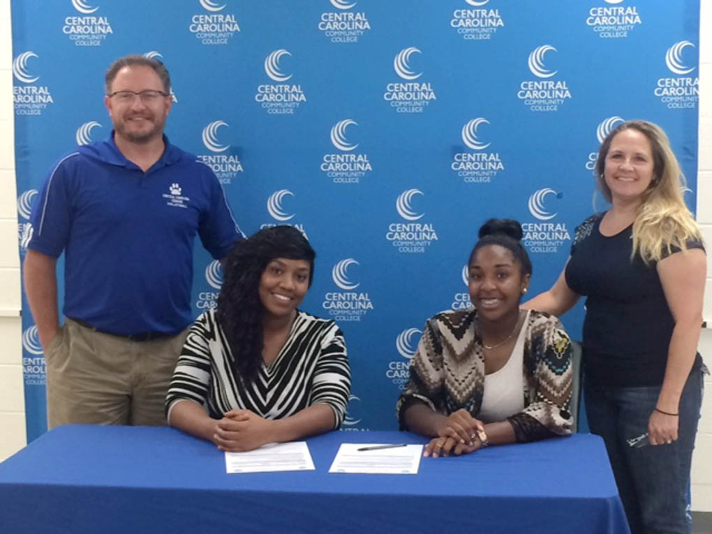 Two sign with Lady Cougar volleyball