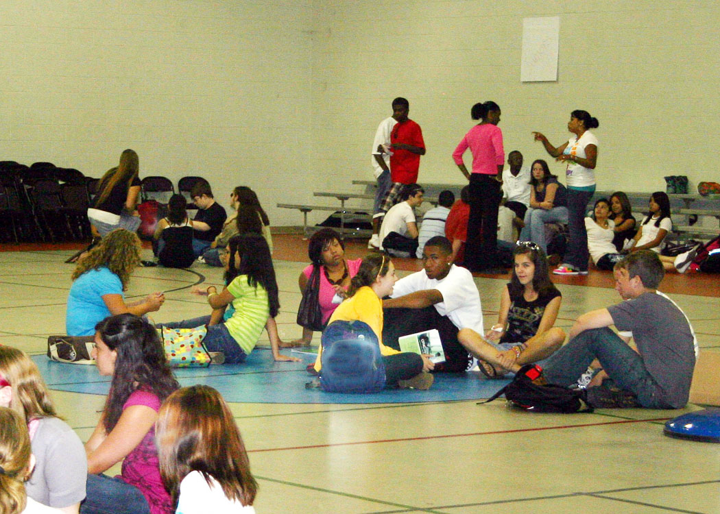 Click to enlarge,  Lee Early College students gather in small groups in the gymnasium at Central Carolina Community College to get to know each other at the start of the first day of classes Wednesday. The college, located on the college's Lee County Campus, is collaboration between the college and Lee County Schools. Students attend for five years and earn both a high school diploma and an associate degree at no cost to them. 
