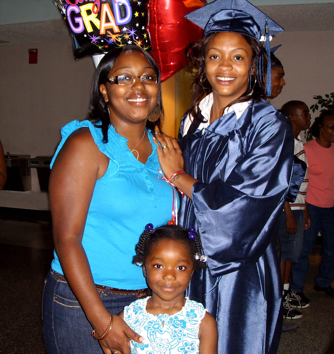 Click to enlarge,  Saprina Smith (right), of Lee County, received her General Educational Development diploma at Central Carolina Community College&#8217;s Adult High School and GED graduation exercises June 18 at the Dennis A. Wicker Civic Center. On hand to help Smith celebrate were her friend Brandi Smith (left) and Brandi&#8217;s daughter, Kourtney. Approximately 190 adults completed high school or a GED through the college&#8217;s adult education program during the spring semester.&amp;nbsp; 