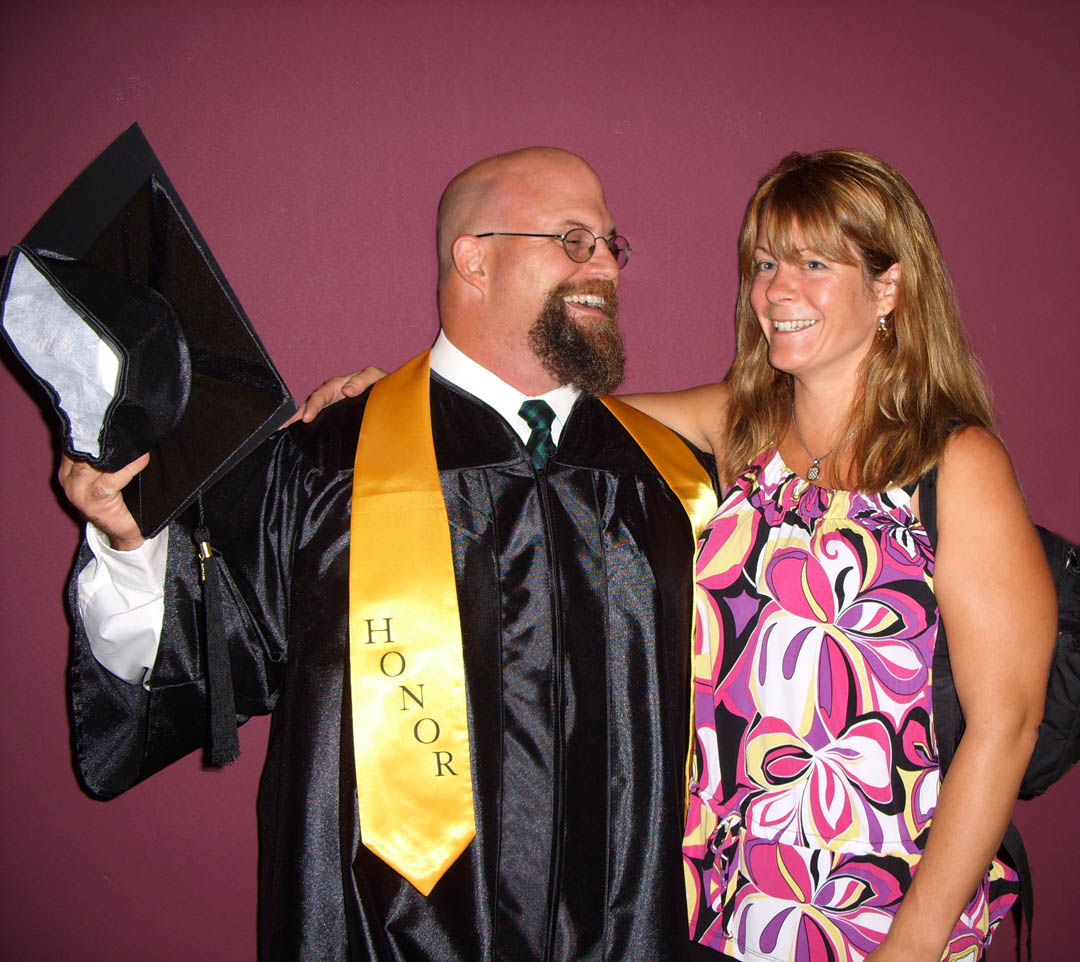 Click to enlarge,  Andrew Kudlak and his wife, Alison, are all smiles after Kudlak received his A.A.S. in Machining Technology-Tool, Die and Mold Making during Central Carolina Community College&#8217;s summer graduation Aug. 6 at the Dennis A. Wicker Civic Center. Kudlak, of Cumberland County, was also one of the student speakers for the event. He plans to continue his education at Central Carolina C.C. to earn a Mechanical Engineering Technology degree. 