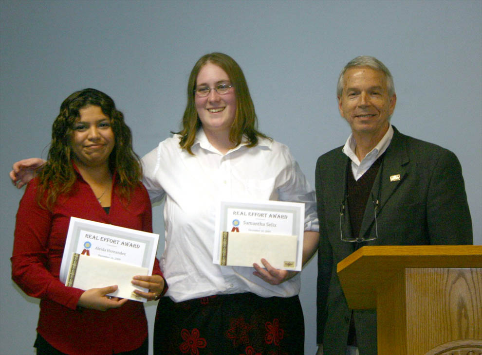 Click to enlarge,  Bob Joyce (right), president of the Sanford Area Chamber of Commerce, presents the Chamber&#8217;s REAL Best Business Plan Award to Aleida Hernandez (left) and Samantha Selix, both of Lee County, during graduation ceremonies for Central Carolina Community College&#8217;s REAL (Rural Entrepreneurship through Action Learning) class. The graduation took place Dec. 16 at the Dennis A. Wicker Civic Center, in Sanford. The 16-week class, offered in partnership with N.C. REAL Enterprises, trains would-be entrepreneurs to turn their ideas into a feasible business plan. The award is based on the recipient&#8217;s creative idea, attendance, homework, and business plan developed. &amp;nbsp;Hernandez&#8217;s planned business is Events to Remember; Selix&#8217;s is Paws A Day Pet Sanctuary and Clinic. For more information about REAL, contact Diane Kannarr, CCCC REAL, business and marketing instructor, (919) 718-7247; Jim Felton, Lee Small Business Center director, (919) 718-7545; or Gary Kibler, Chatham Small Business Center director, (919) 542-6495. 