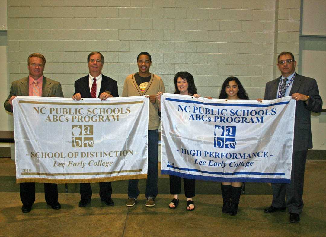 Click to enlarge,  Proud administrators, faculty and students display two banners that Lee Early College has received from the North Carolina Department of Public Instruction for its academic achievement during the 2009-10 school year. The banner on the left, held by (from left) Lee County Schools Superintendent Jeff Moss, Central Carolina Community College President Bud Marchant, and LEC 2009-10 SGA President Shakeel Harris, honors the school for achieving School of Distinction ranking. The banner on the right, held by (from center right) LEC Teacher of the Year Tonya Comeaux, LEC 2010-11 SGA President Gloribel Vanegas, and LEC Principal Robert Biehl, honors the school for high performance. Lee Early College, a collaboration of Lee County Public Schools and the college, is located on the college&#8217;s Lee County Campus. Students complete requirements for both their high school diploma and an associate degree or two years of university transfer credit in four to five years. For more information about Lee Early College, visit its web site,  www.lee.lec.schoolfusion.us  or call (919) 718-7259. 