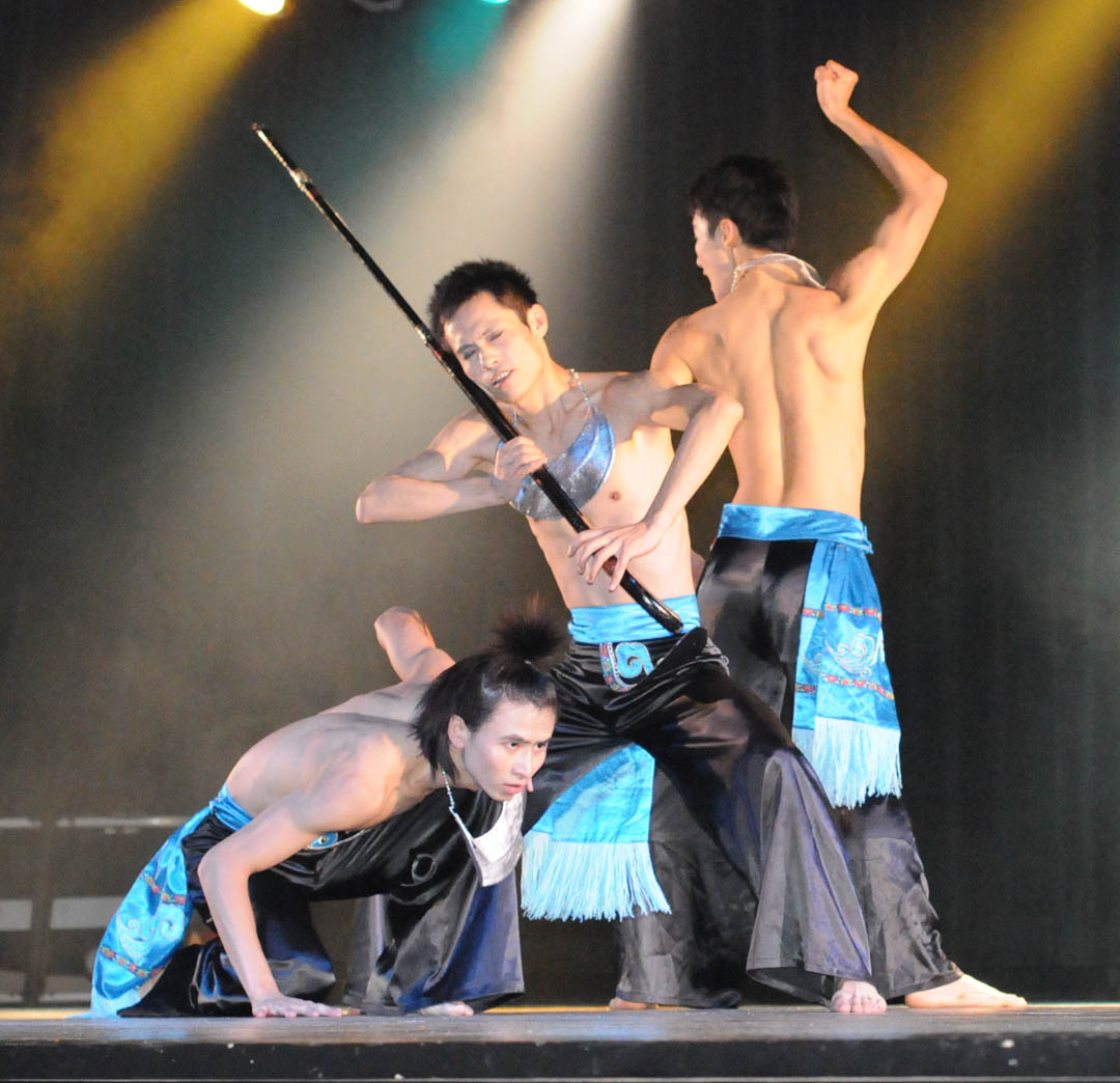Click to enlarge,  Tao Yu, Bo Jiang and Fei Han (not shown in order), members of the Ethnic Arts Troupe at Jishou University&#8217;s College of Music and Dance, perform &#8216;Tree Worship in the Basha Tribe&#8217; during the troupe&#8217;s show Sunday at the Dennis A. Wicker Civic Center. The trio wears the traditional costume of the Basha tribe in Hunan Province, the People&#8217;s Republic of China. The troupe performed, with dance, song, and instruments, 11 traditional songs, primarily from the Miao and Tujia ethnic groups in the province, where the university is located. Martial artists demonstrated kung fu as part of the program. Central Carolina Community College&#8217;s Confucius Classroom, in partnership with North Carolina State University&#8217;s Confucius Institute, hosted the free performance. For more information about CCCC&#8217;s Confucius Classroom, visit  www.cccc.edu/confucius  or call (919) 718-7386 or (919) 718-7376. 