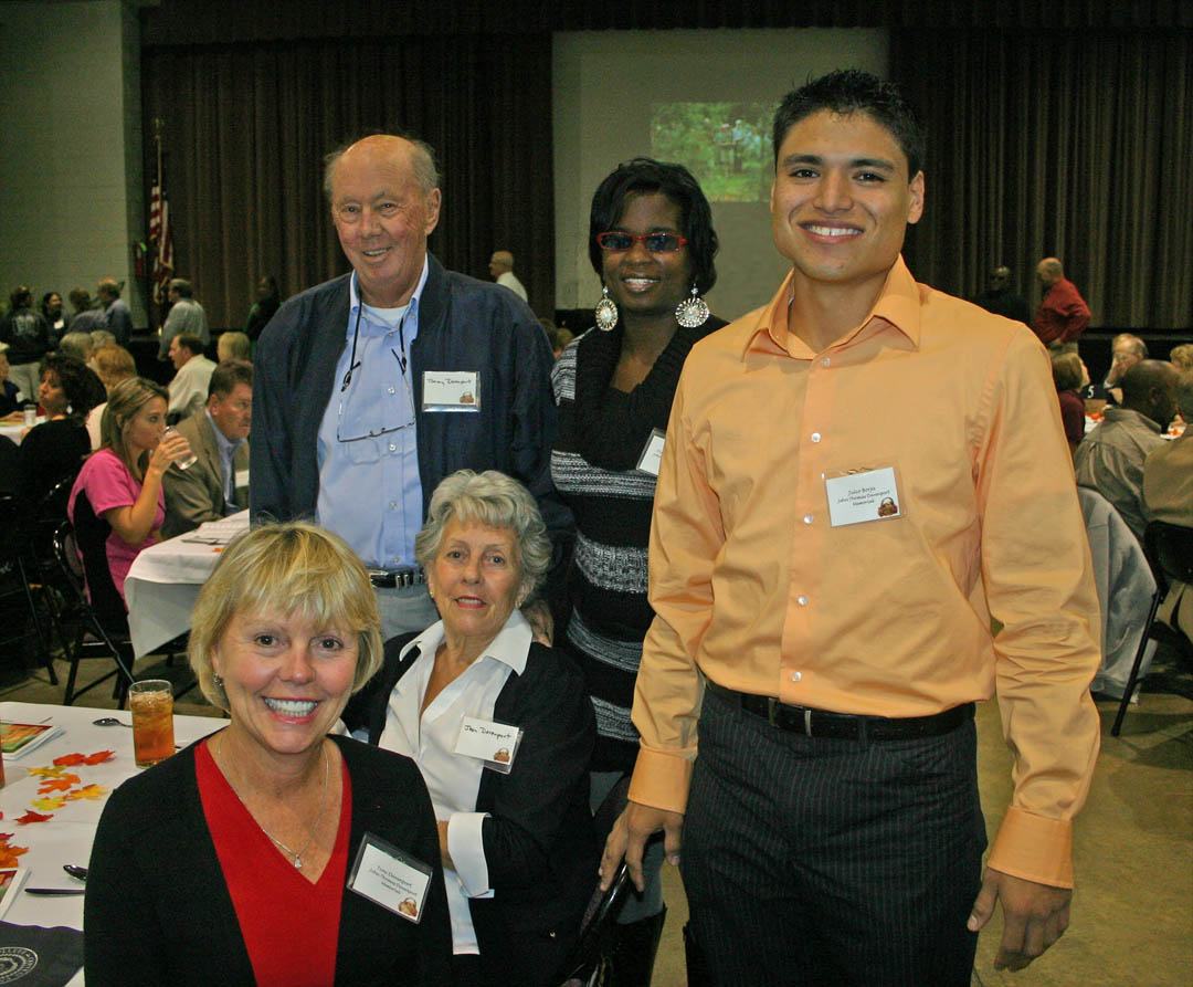 Click to enlarge,  Several hundred scholarship donors and recipients gathered Nov. 16 at the Dennis A. Wicker Civic Center, in Sanford, for the Central Carolina Community College Foundation Scholarship Luncheon. The luncheon provided an opportunity for the donors to become personally acquainted with those they are helping and enabled the recipients to thank them in person. The Davenport family, of Sanford, came to meet the recipients of the scholarships they established in the name of John Thomas Davenport, a former Sanford businessman. Pictured are (front, from left) Toni Davenport, granddaughter of John Thomas; and university transfer student Julio Borja, of Sanford; (middle) Jean Davenport, daughter-in-law of John Thomas; and (back, from left) Tommy Davenport, son of John Thomas, and criminal justice student Diaundra Baldwin, of Sanford. For information on establishing scholarships or endowments, contact the CCCC Foundation at (919) 718-7231 or  dglover@cccc.edu . 