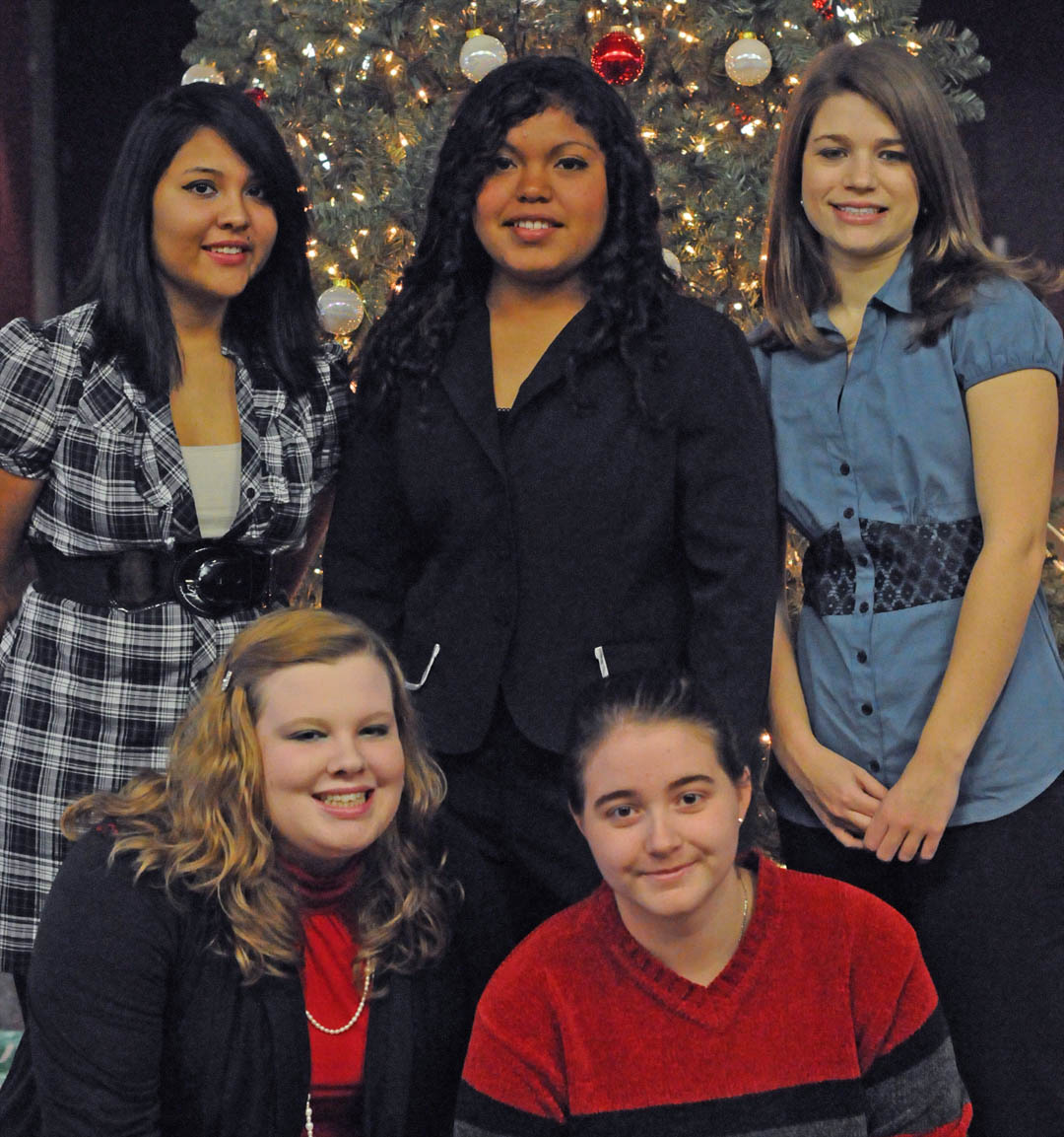 Click to enlarge,  Lee Early College students (front, from left) Ariel Hickerson and Amanda Barnes, and (back, from left) Kimberly Castillo, Nancy Urias, and Danielle Fiore, received their high school diplomas and Associate in Arts-University Transfer degrees Dec. 22 in graduation exercises at the Dennis A. Wicker Civic Center. Lee Early College is a collaboration of Lee County Schools and Central Carolina Community College. LEC students can, within five years, earn both a high school diploma and an associate degree at no cost. All five plan to continue their education at a university. They will have standing as juniors because they earned their A.A.-U.T degrees. For more information about Lee Early College, visit its Web site, www.leeearlycollege.com. For more information about Central Carolina Community College, visit  www.cccc.edu . 