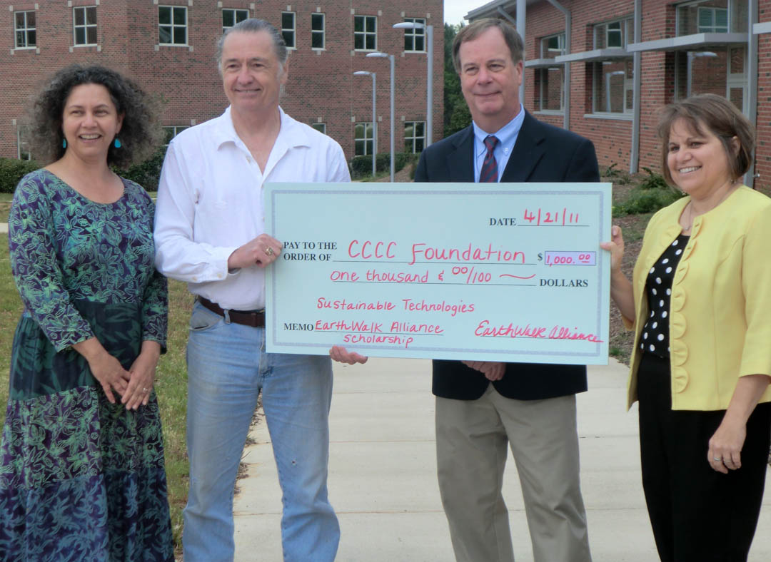 Click to enlarge,  EarthWalk Alliance President Tim Watson (center, left) presents Central Carolina Community College President Bud Marchant (center, right) with a $1,000 scholarship check for the school's Sustainable Technologies program. EarthWalk Alliance, a Hillsborough-based nonprofit, established the scholarship in recognition of the college's reputation in the sustainable technologies field. Also pictured are Laura Lauffer (left), CCCC&#8217;s sustainability coordinator and the program's lead instructor, and Karen Allen (right), CCCC Provost for Chatham County. Information about the scholarship can be obtained by contacting Lauffer at (919) 545-8032 or at  llauffer@cccc.edu . 