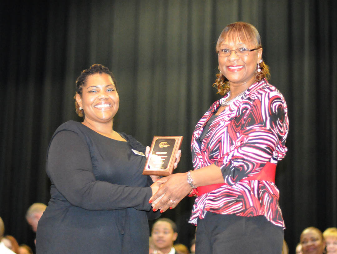 Click to enlarge,  Central Carolina Community College honored 72rnoutstanding graduating curriculum students during its 16 th  AnnualrnAcademic Excellence Awards Night May 4 at the Dennis A. Wicker Civic Center. LorarnBradley (right), of Chatham County, accepts the award for Academic Excellencernin Human Services from sociology instructor Vadrin Colvin-King. 