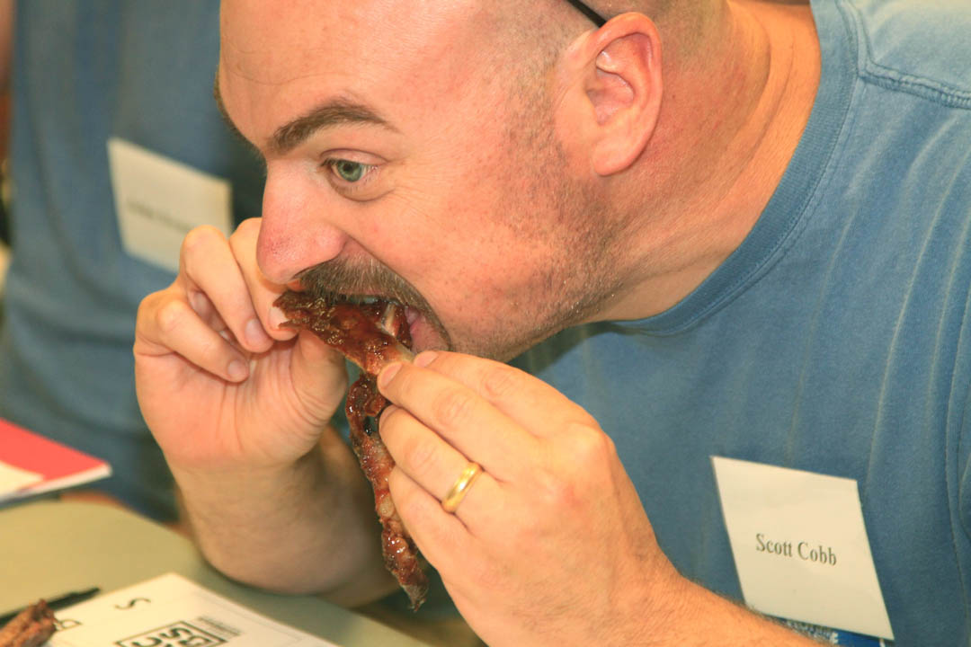 Click to enlarge,  Scott Cobb, of Chesapeake, Va., savors a piece of barbecue while learning how to judge various types of barbecue during Central Carolina Community College&#8217;s Barbeque Judging class June 11 at its Harnett County Campus. Don Harwell, vice president of the Kansas City Barbeque Society, taught the class. The Continuing Education class attracted 55 people from North and South Carolina, Virginia, Pennsylvania, Georgia, and Florida. For more information about Continuing Education classes, visit the CCCC Web site at  www.cccc.edu  and click on &#8220;Continuing Education.&#8221; 