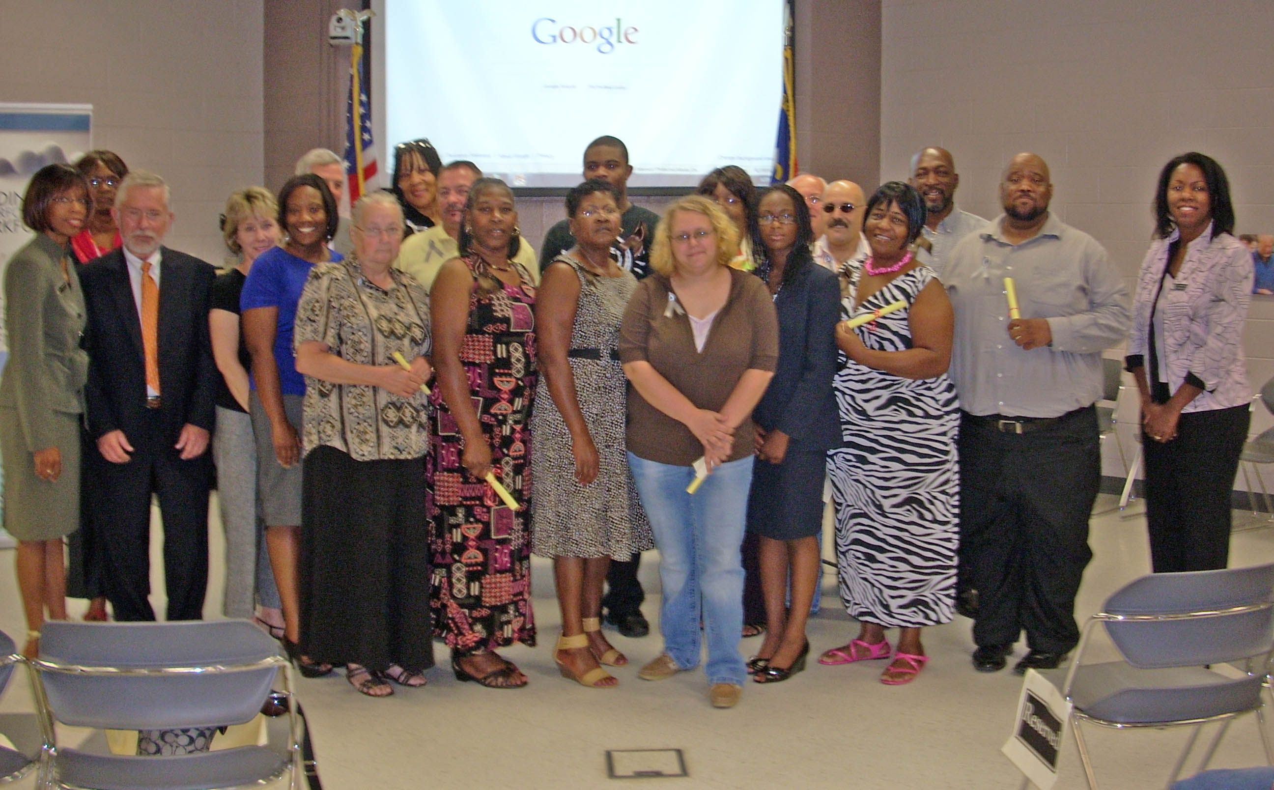 Click to enlarge,  Central Carolina Community College honored 30 recipients of N.C. Career Readiness Certificates at a recognition ceremony Aug. 11 at its Harnett County Campus. The recipients had successfully passed Career Readiness Certificate assessments at the Bronze, Silver or Gold level, indicating their basic workforce skill levels in applied math, reading for information, and locating information. Those receiving their certificates (not shown in order) were: Gold - Victor Bass, of Lillington, and Luther Tannerhill, of Linden; Silver - Demetrius Dahilia, Jamerson Campbell and Connie Greene, all of Dunn; Ricky Blackmon, of Lillington; Dora Martinez, of Angier; Louis Scrantino, of Fuquay Varina; and Mary Mitchell, of Spring Lake; and Bronze - Angela Gunn, Ebony Ray, Judy Walker, Prentiss McLean, and Mayanna Geddie, all of Bunnlevel; Jamaica Wilkerson, and Allene Ferguson, both of Dunn; Jeanette Grady and Paulette Chance, both of Lillington; Jeremy Aycock, of Godwin; Sylvia McLean, of Erwin; and Jamie Brannon, of Angier. Also at the ceremony were Dr. Stelfanie Williams, CCCC vice president of CCCC's Economic and Community Development Division; Bill Tyson, CCCC Harnett provost; Phyllis Huff, dean of Adult and Continuing Education; Len Royals, CCCC director of Continuing Education in Harnett County; CRC coordinator Patricia Stone-Hackett; HRD instructor/coordinator Nicole Brown; Jim Futrell, CRC Advisory Board chairman; and CCCC trustee Clem Medley.   