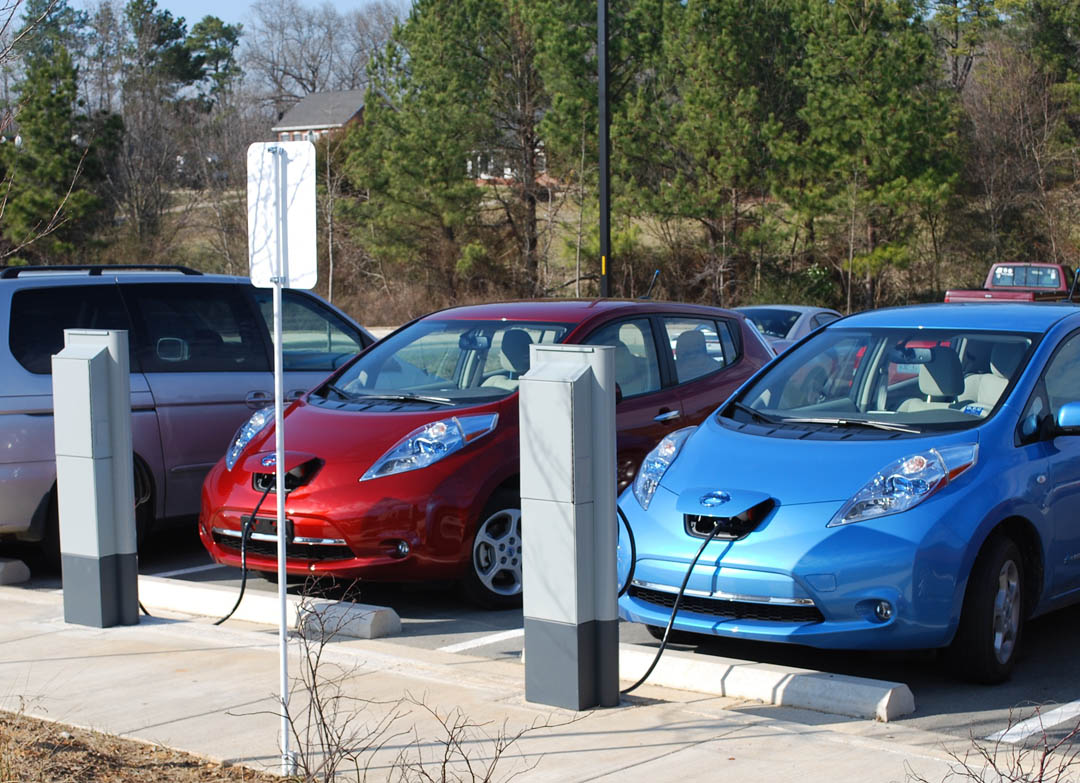 Click to enlarge,  Two Nissan Leafs fill up their batteries instead of gas tanks at plug-in electric vehicle (PEV) charging stations at Central Carolina Community College's Chatham County Campus, in Pittsboro. The charging stations are the campus's newest additions to its environmentally friendly features, including green buildings and sustainable programs. The public charging stations are among the first 12 that Progress Energy Carolinas has installed at various locations in North Carolina in a project to assess the need, cost and challenges of having a network of public charging stations and their possible impact on the electric grid. 