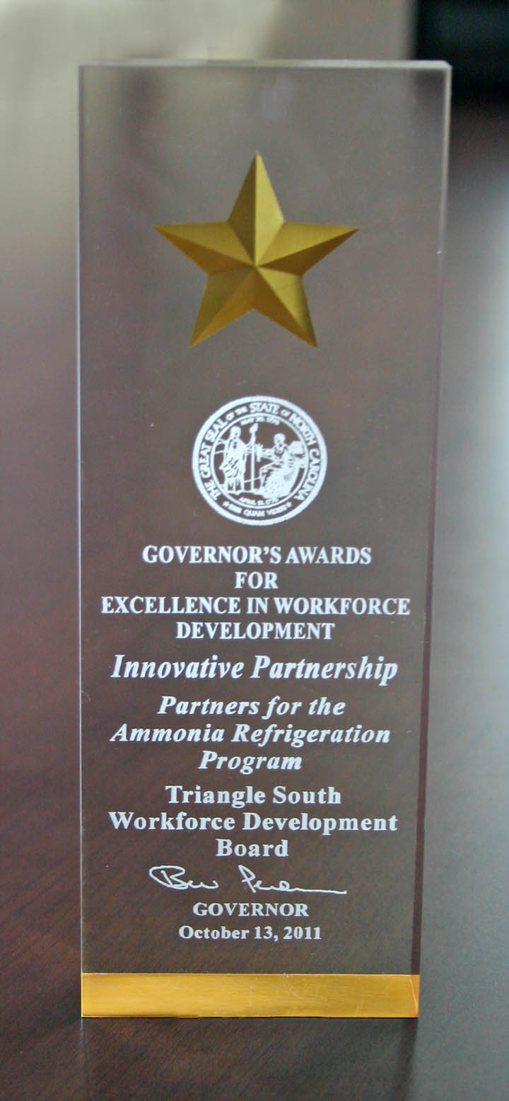 Click to enlarge,  The Triangle South Workforce Development Board at Central Carolina Community College received the 2011 North Carolina Governor's Award for Excellence in Workforce Development-Innovative Partnership. The award was presented for partnering with Sampson Community College in an ammonia refrigeration workforce training program. The TSWDB works with community partners to assist youth, adults and dislocated workers in gaining workforce skills and finding employment. CCCC was the first community college in the state with a workforce development board office. For more information about the TSWDB visit its web site,  www.trianglesouthworkforce.com , or call the TSWDB office at 919-775-7795.  