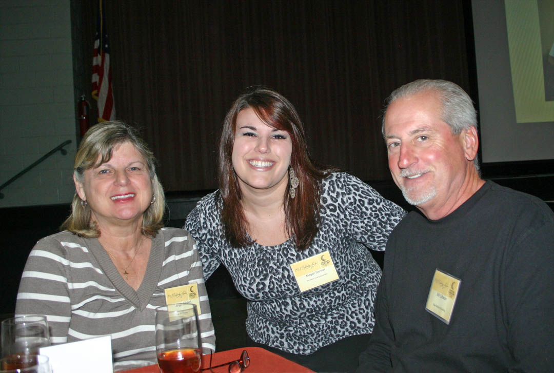 Click to enlarge,  Megan Danner (center), a Central Carolina Community College practical nursing student from Lee County, is attending school with the help of the Sue Gibson Nursing Scholarship. At the Nov. 15 CCCC Foundation Scholarship Luncheon at the Dennis A. Wicker Civic Center, she was able to meet and thank Jinger (left) and Bill Gibson, the donors of her scholarship.  Through the Foundation, donors provided $175,000 in scholarships to CCCC students this year. The Foundation is a 501(c)(3) charitable organization affiliated with, but independent of the college. It receives donations of money and equipment on behalf of CCCC and uses them to promote the educational mission of the college and assist students through scholarships and grants. For information on establishing scholarships or endowments, contact CCCC Foundation Executive Director Diane Glover, 919-718-7231 or dglover@cccc.edu, or Associate Director Emily Hare, 919-718-7230 or ehare@cccc.edu. To apply for a scholarship, contact the CCCC Financial Aid Office at /www.cccc.edu/financialaid/ or 919-718-7229. 