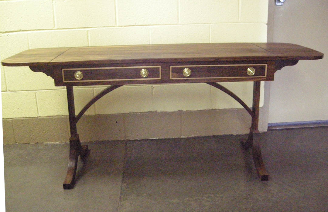Click to enlarge,  A beautifully detailed drop-leaf table will be among the items up for bid at the Central Carolina Community College Foundation's 13th Annual Furniture Auction Saturday, June 1, in the Multipurpose Room of the Miriello Building on the college's Harnett County Campus, 1075 E. Cornelius Harnett Blvd. Viewing and registration starts at 9 a.m. and bidding, at 10 a.m. For more information about the CCCC Foundation Furniture Auction, call (910) 893-9101 or go online to www.cccc.edu/foundation/events/furnitureauction to see a photo gallery of the auction pieces. 