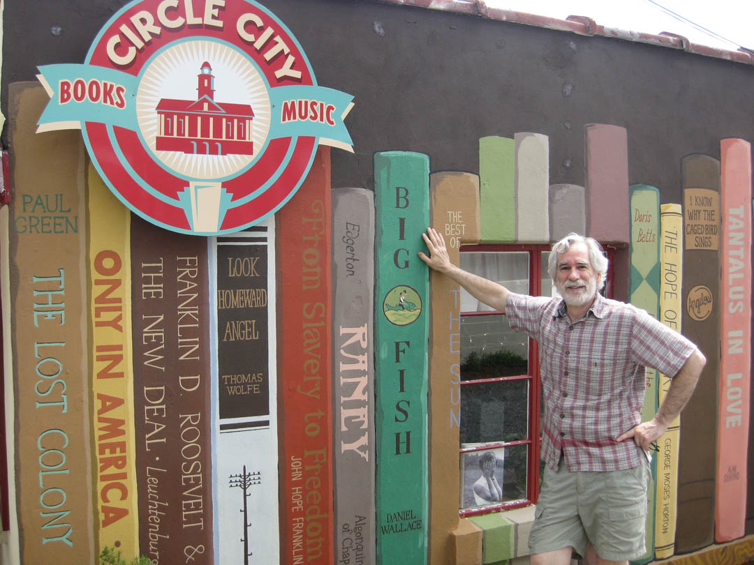 Click to enlarge,  Visit downtown Pittsboro and you can't miss Myles Friedman's Circle City Books &amp; Music store - it's the one at 121 Hillsboro St. with the gigantic mural of books on the side wall. Friedman's store offers used and rare books as well as records and CDs. In getting set up, he worked with Gary Kibler, director of Central Carolina Community College's Small Business Center, in Pittsboro, to be certain he had a workable plan and met city and county requirements for businesses. For more information about the store, visit its Facebook page, www.facebook.com/pages/Circle-City-Books-Music, or call 919-548-5954. For more information about CCCC's Small Business Center in Chatham County, email gkibler@cccc.edu or call 919-542-6495, ext. 215. For the Small Business Center in Lee County, call 919-718-7424 or email mjones@cccc.edu. For the Small Business Center in Harnett County, email nblackman@cccc.edu or call 910-892-2884. 