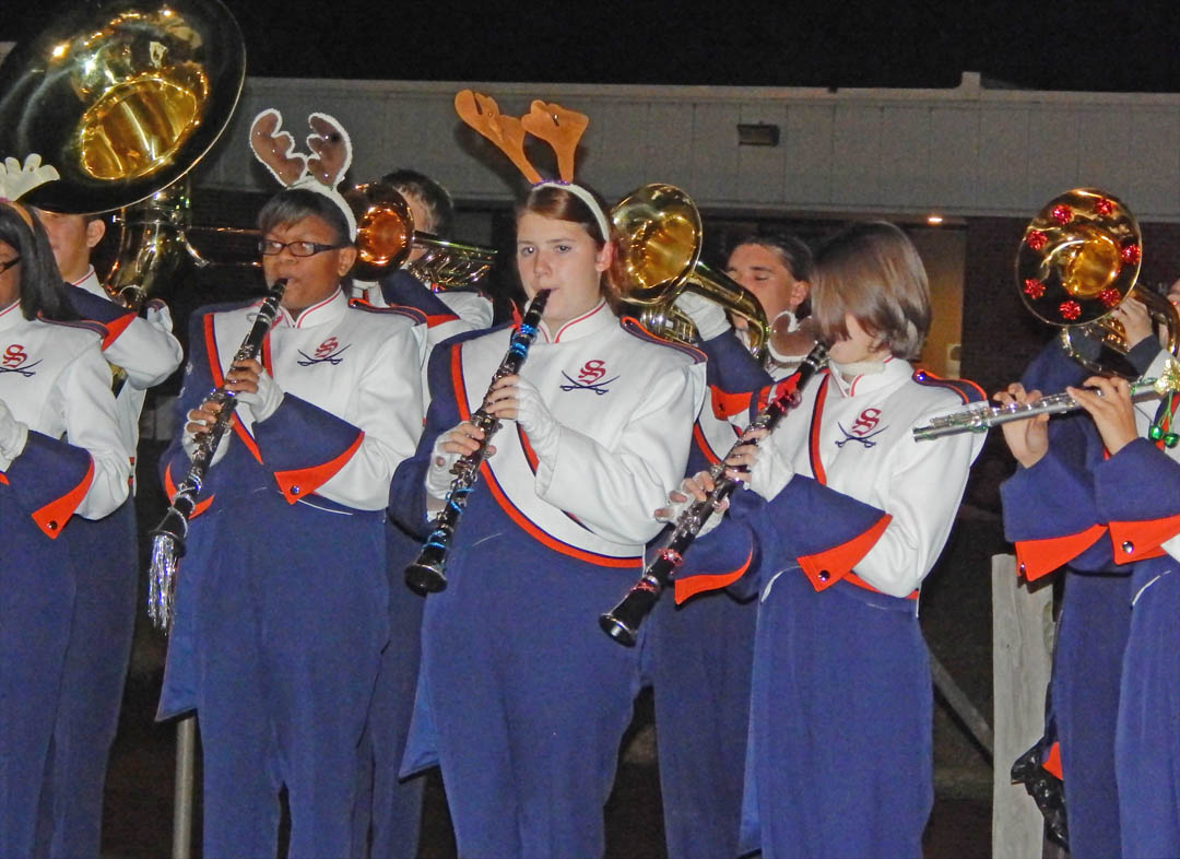 Click to enlarge,  The Southern Lee High School Marching Band, under music director Alexander Alberti and led by head drum major Lauren Simmonds, entertained visitors at Central Carolina Community College's Dec. 5 Christmas Tree Lighting community celebration. During the event at the college's Lee County Campus, visitors also enjoyed meeting and having their picture taken with Santa Claus, watching the tree lighting, listening to a reading of ''Twas the Night Before Christmas,' and refreshments. Those who had pictures taken with Santa can view and download them at the college's website, www.cccc.edu/santapics/. 