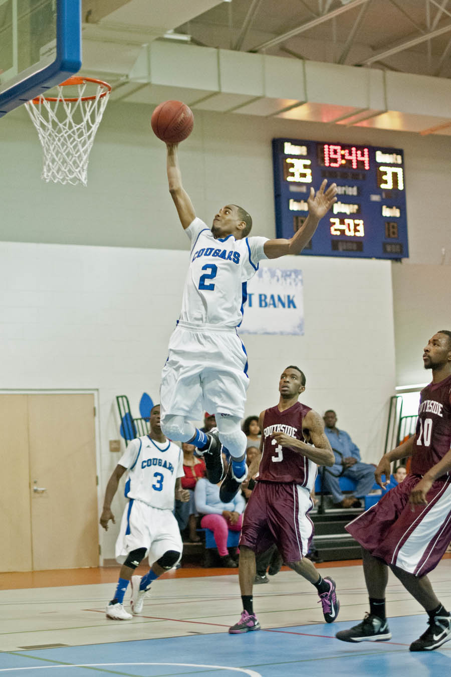 Click to enlarge,  Deinzel Greene opens the second half  of the Dec. 5 Central Carolina Community College versus Southside Virginia Community College game with a dunk off a Josh Lee steal to tie the score and spark a run. The hard-fought game went into overtime, where the Cougars lost  98-99.   