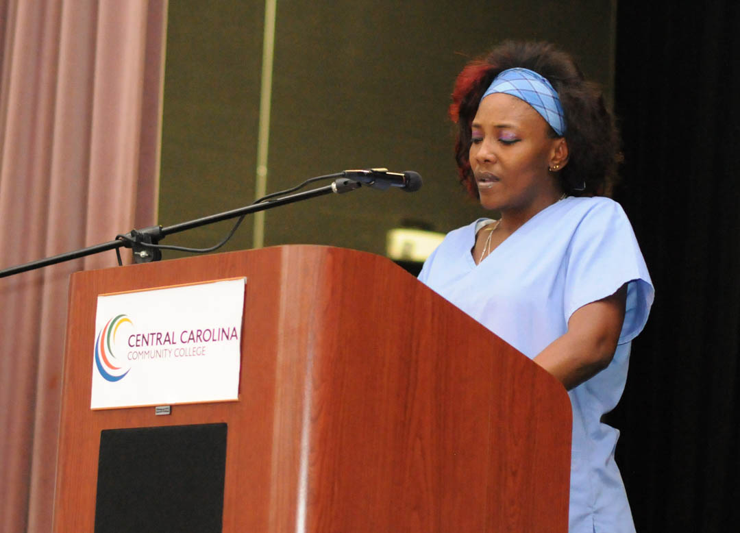 Click to enlarge,  Regina Davis, of Lee County, addresses the Central Carolina Community College Continuing Education Department's Medical Programs graduation Dec. 12 at the Dennis A. Wicker Civic Center. Dickerson received her Nurse Aide I certificate. More than 400 students completed their studies for their certificates in a variety of medical programs during the fall semester. For more information about Continuing Education medical programs at CCCC, call 919-545-8044 in Chatham County, 910-814-8823 in Harnett County, or 919-777-7793 in Lee County. For information on spring Continuing Education programs, see the schedule online at www.cccc.edu/ecd/schedule/.  