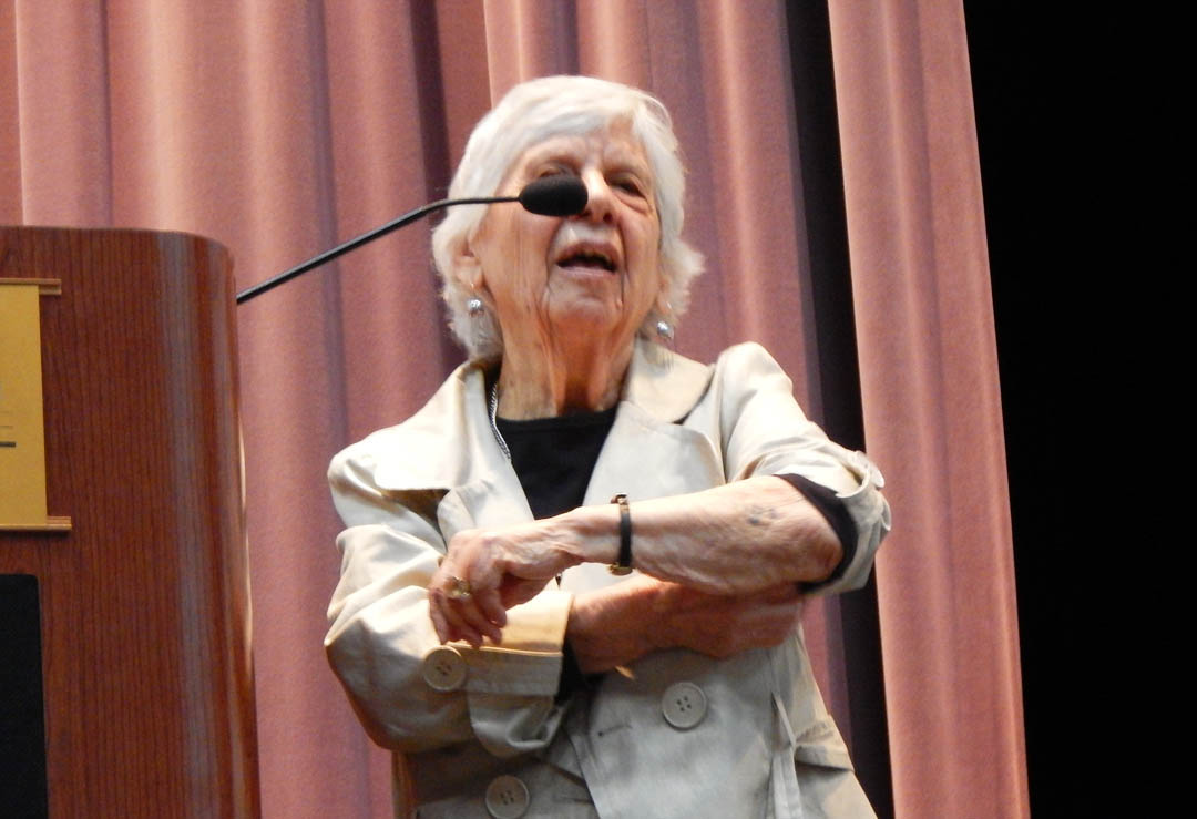 Click to enlarge,  Rebecca Yomtov Hauser, a Holocaust survivor, shows the arm tattoo she received in the Nazi Auschwitz-Birkenau concentration/extermination camp during World War II.  She spoke to students and community members April 29 in the Dennis A. Wicker Civic Center at Central Carolina Community College's Lee County Campus. All members of her immediate family were killed in the Holocaust. Holocaust Remembrance Day was April 28. After years of silence about her experience, she now talks to groups to provide a voice for all those whose voices were silenced in the extermination camps. For more information about Holocaust survivor speakers, contact the Chapel Hill-Durham Holocaust Speakers Bureau, www.holocaustspeakersbureau.org. For more information about Central Carolina Community College, visit www.cccc.edu. 