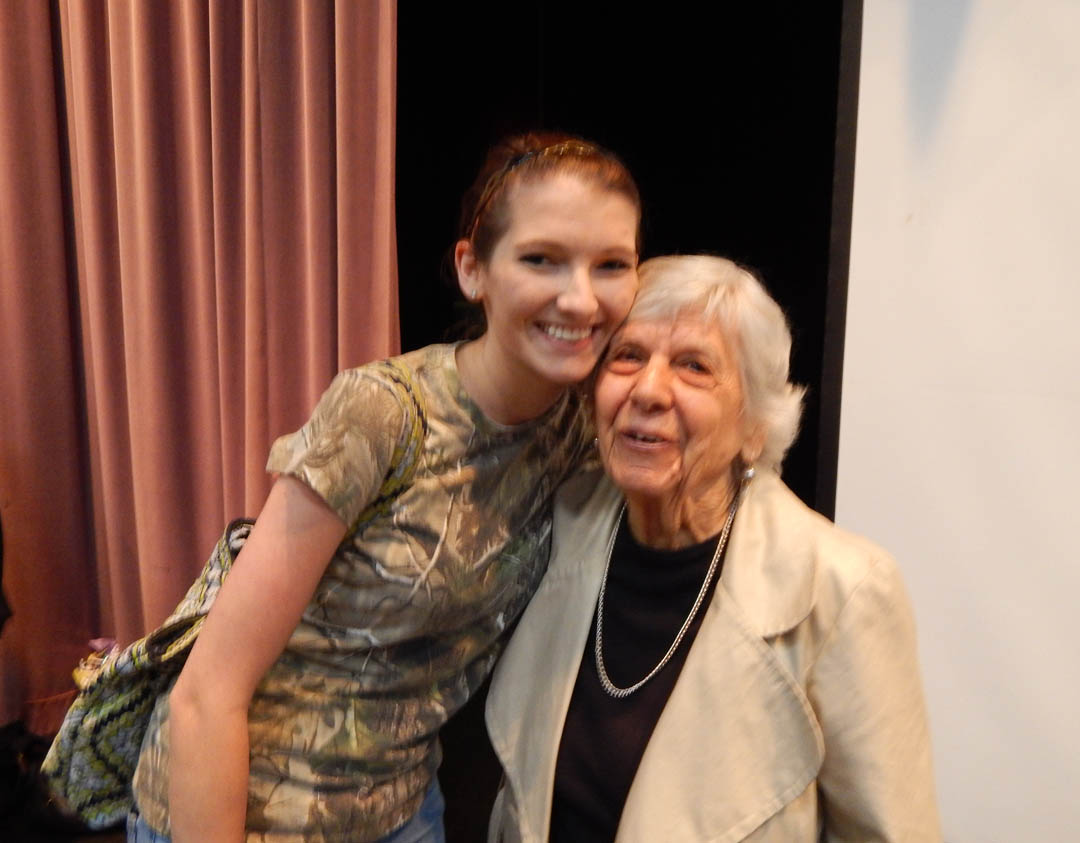 Click to enlarge,  Rebecca Yomtov Hauser (right), a Holocaust survivor, gets a hug from Central Carolina Community College student Rachel Morris, of Sanford, following Hauser's talk to an audience of students and community members about her experiences. She was interned at the Nazi Auschwitz-Birkenau concentration/extermination camp during World War II.  Hauser spoke April 29 in the Dennis A. Wicker Civic Center at the college's Lee County Campus. All members of her immediate family were killed in the Holocaust. Holocaust Remembrance Day was April 28. After years of silence about her experience, she now talks to groups to provide a voice for all those whose voices were silenced in the extermination camps. For more information about Holocaust survivor speakers, contact the Chapel Hill-Durham Holocaust Speakers Bureau, www.holocaustspeakersbureau.org. For more information about Central Carolina Community College, visit www.cccc.edu. 