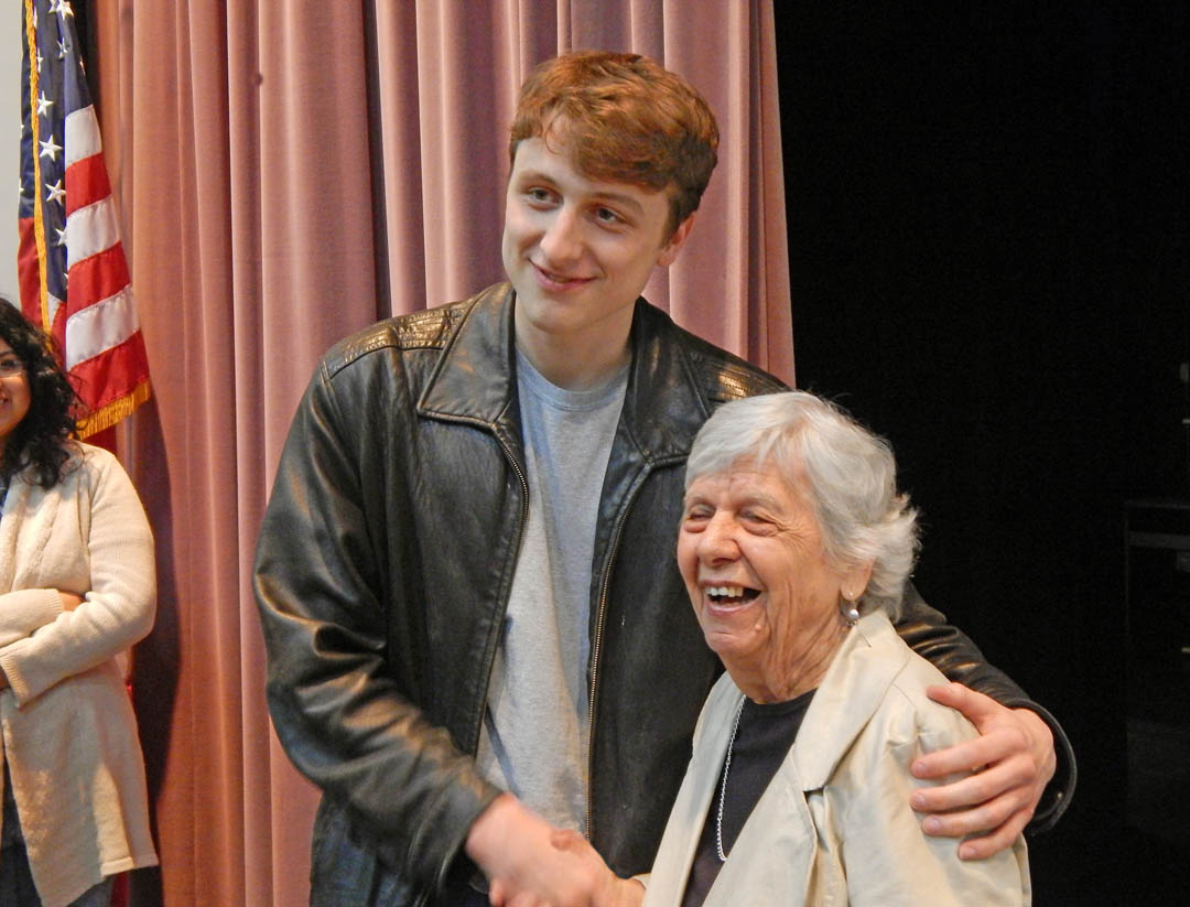 Click to enlarge,  Rebecca Yomtov Hauser (right), a Holocaust survivor, greets Central Carolina Community College student Nicholas Snouwaert, of Chatham County, following Hauser's talk to an audience of students and community members about her experiences. She was interned at the Nazi Auschwitz-Birkenau concentration/extermination camp during World War II.  Hauser spoke April 29 in the Dennis A. Wicker Civic Center at the college's Lee County Campus. All members of her immediate family were killed in the Holocaust. Holocaust Remembrance Day was April 28. After years of silence about her experience, she now talks to groups to provide a voice for all those whose voices were silenced in the extermination camps. For more information about Holocaust survivor speakers, contact the Chapel Hill-Durham Holocaust Speakers Bureau, www.holocaustspeakersbureau.org. For more information about Central Carolina Community College, visit www.cccc.edu. 