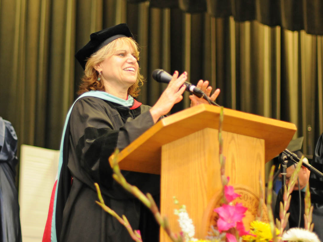 Click to enlarge,  Dr. Karen Allen, Central Carolina Community College's Chatham County provost since 1996, welcomes graduating students and guests to the college's June 19 Adult High School/GED graduation at the Dennis A. Wicker Civic Center, in Sanford. Allen retired June 30 after a 26-year career with the college. She had also taught four years at Randolph Community College, for a total of 30 years of service to adult learners with the North Carolina Community College System. For more information about the college, visit its website, www.cccc.edu. 