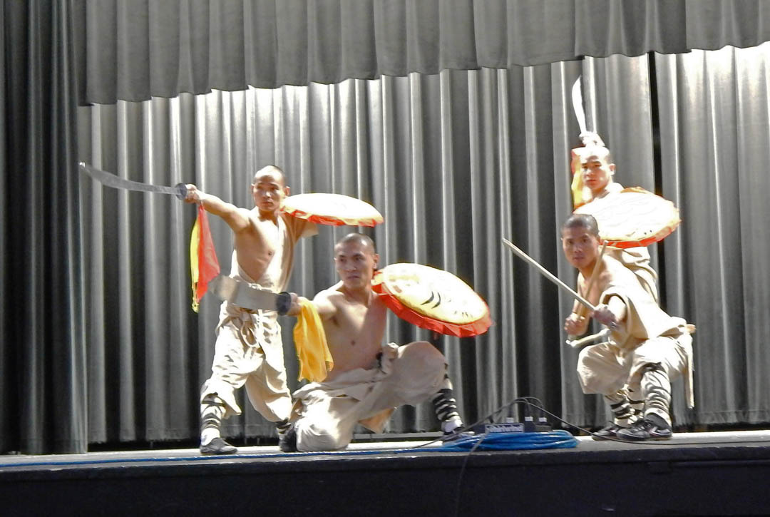 Click to enlarge,  Four kung fu masters of the Shaolin Kung Fu Mission, People's Republic of China, performed a demonstration of martial arts Sept. 16 that impressed an audience of several hundred with their skill, agility, and mental and physical discipline and power. The performance, at the Dennis A. Wicker Civic Center, was a collaborative effort by Central Carolina Community College's Confucius Classroom, N.C. State University's Confucius Institute and Pfeiffer University's Confucius Institute. The four masters (pictured, not in order), Yunnan Liu, Zhongxu Mu, Yuehui Yuan and Sun Gaoyang, served as kung fu coaches for the Chinese Kung Fu Center at Pfeiffer from 2009 to 2012. The masters demonstrated barehanded and weapon styles of martial arts. The audience watched amazed and impressed as, among other feats, a master bent a long spear with his neck, another broke an iron bar with his head, and another used a needle to punch a hole in glass without shattering it. For more information about CCCC's Confucius Classroom, visit www.cccc.edu/confucius. 