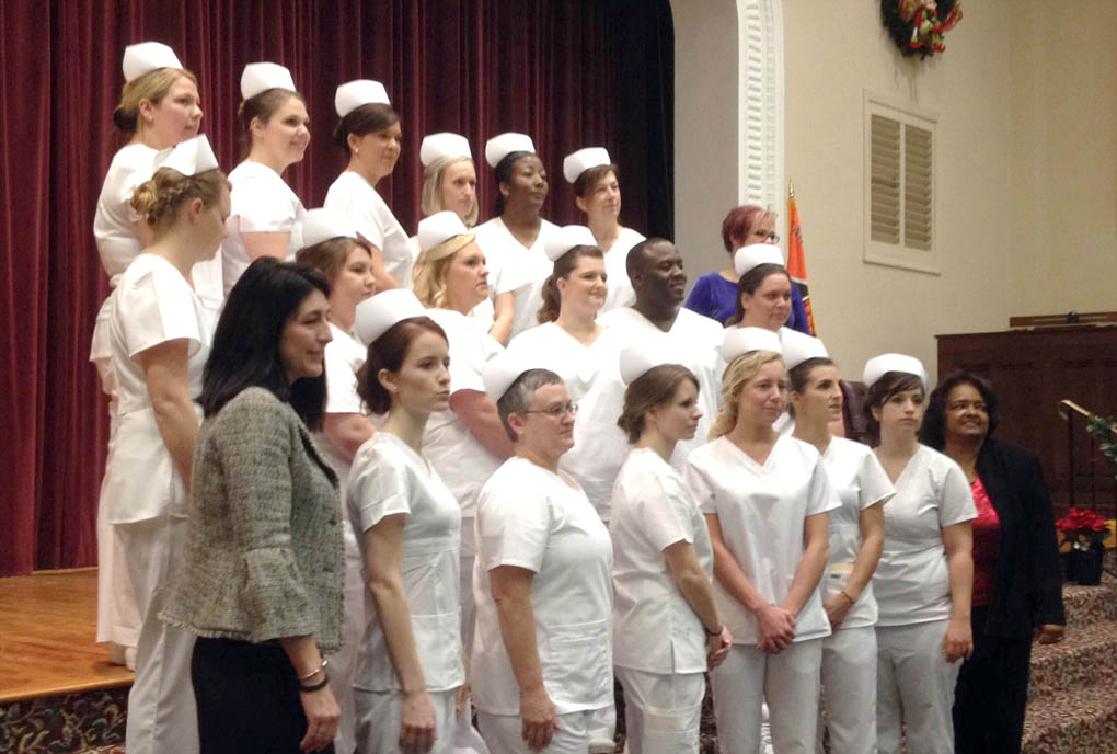 Click to enlarge,  The Central Carolina Community College Louise L. Tuller School of Nursing recently held its graduation ceremony for Practical Nursing. Pictured are, left to right: front row, Angela Swank, Instructor; Tina Cook; Renee Hankins; Jessica Cameron; Roberta Sorrell; Hannah Williams; and Lena Clayton, Instructor; second row, Amy Foisy; Destiny Amick; Kristen Johnson; Summerlin Blackmon; Kristin Helsher; and Jessica Del Canto; third row, Amanda Holochworst; Lindsey Schiller; Taylor Beasley; Ernst Barjon; Alesha Childs; Nancy Zink; and Barbara Campbell, nursing department chair. For more information on the CCCC nursing programs, contact Barbara Campbell, CCCC's nursing department chair, at 919-718-7390 or bcampbell@cccc.edu, or Teresa Mangum, CCCC admissions specialist, at 919-718-7313 or tmangum@cccc.edu. To learn more about the CCCC nursing program, visit the college website at www.cccc.edu. 