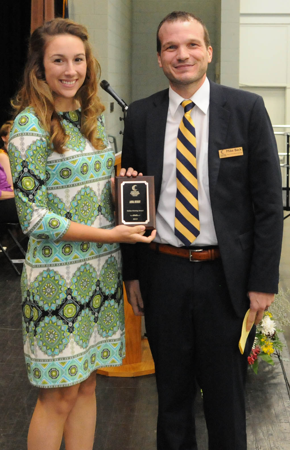 Click to enlarge,  Anna Burby (left) is Central Carolina Community College's nominee for the N.C. Community College System's Dallas Herring Achievement Award. Presenting the award to Burby is Mike Beck, CCCC Dean of Student Learning. 