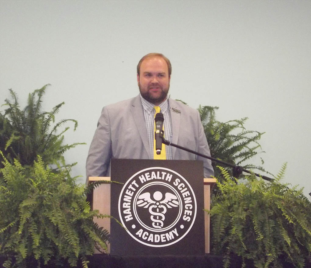 Click to enlarge,  Dr. Brian Merritt, Central Carolina Community College Vice President of Student Learning, provides remarks at the Harnett Health Sciences Academy inaugural induction ceremony. 