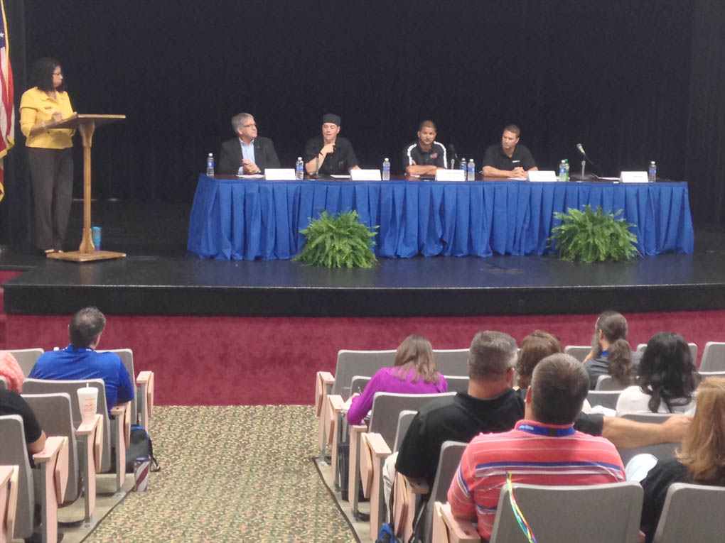 Click to enlarge,  The "Bridging Education and Careers" symposium featured a business and industry panel, which consisted of Jerry Pedley of Mertek, Chef Gregory Hamm of Chef Hamm Inc., Jason Williams of Red Wolf, and Martin Kegel of Caterpillar. 