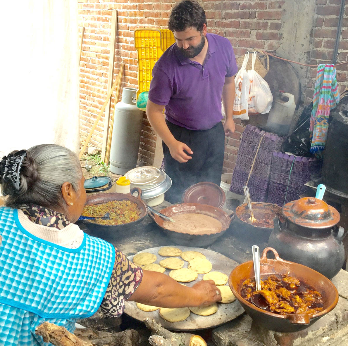 Click to enlarge,  Central Carolina Community College's Jon Spoon (right) looks over the food offerings at one location during his recent visit to Mexico. (Images courtesy of the Center for International Understanding Latino Initiative 2015) 
