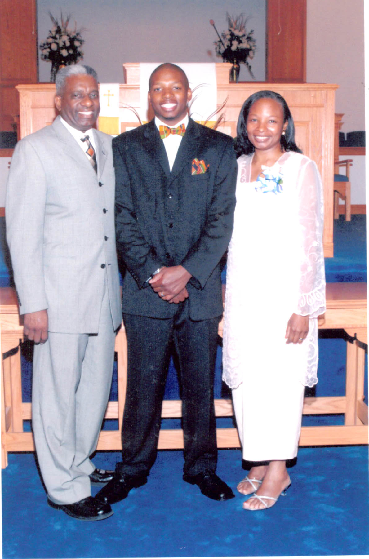 Click to enlarge,  Herman Joseph Morris Jr. (center) is pictured between his parents, the Rev. Dr. Herman J. Morris Sr. and the Rev. Denese Battle Morris. The parents are establishing a scholarship in memory of their son. 