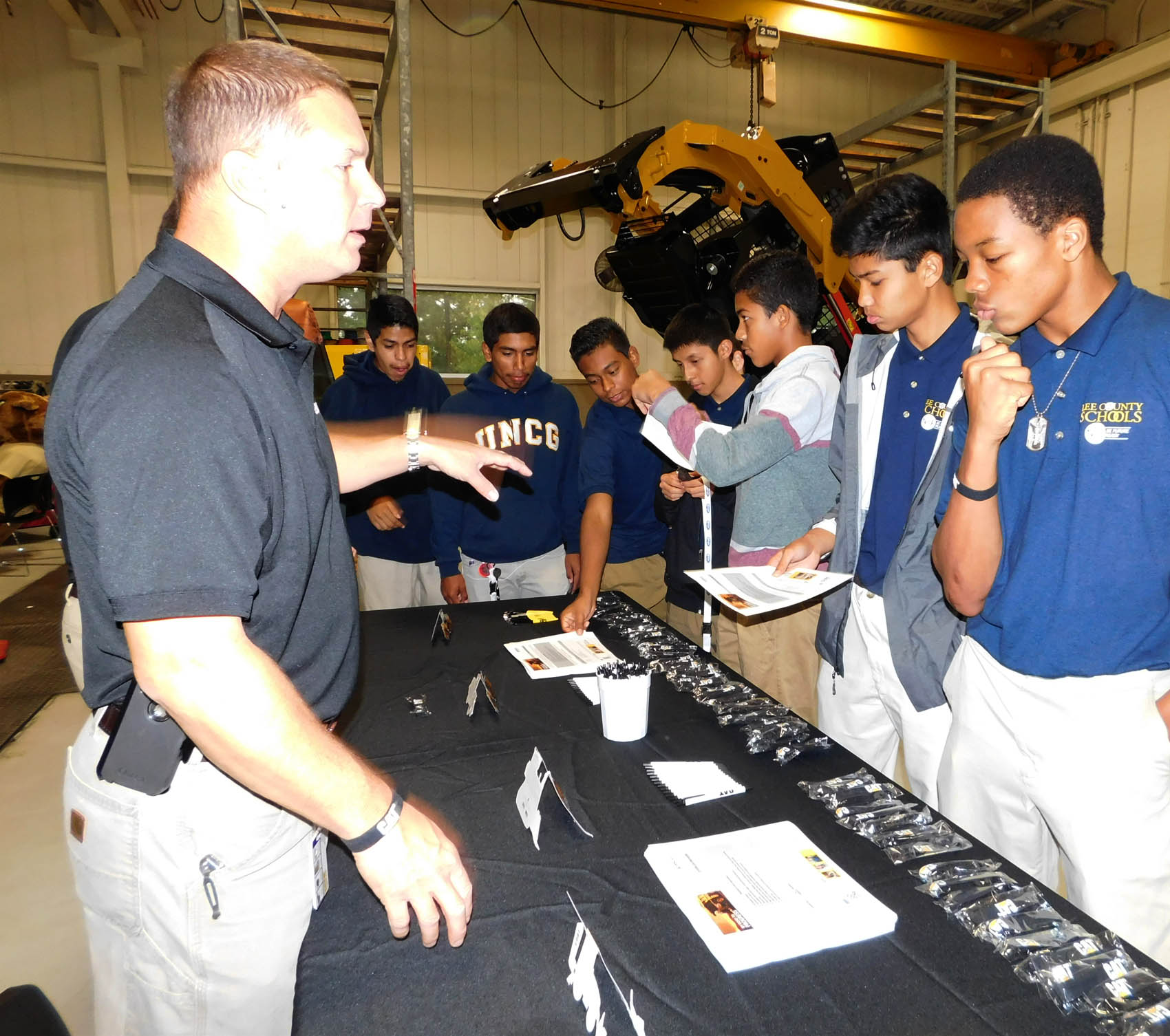 Click to enlarge,  Area students learn more about Caterpillar during National Manufacturing Day at Central Carolina Community College's Innovation Center. 