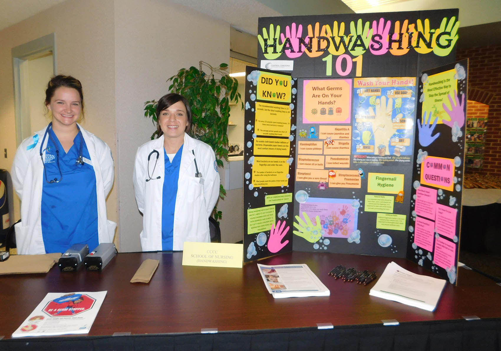Click to enlarge,  Central Carolina Community College School of Nursing students Kathryn Bennett and Heather Herring were pictured during the Lee County Schools/CCCC Family Health &amp; Benefits Fair on Tuesday, Nov. 3, at the Dennis A. Wicker Civic Center. 