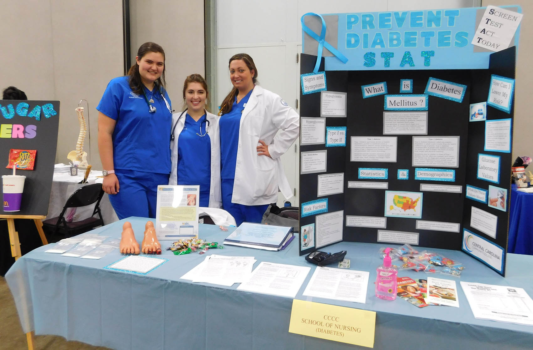 Click to enlarge,  Central Carolina Community College School of Nursing students Danielle Wilson, Lindsey Parks, and Casey Barbour were pictured during the Lee County Schools/CCCC Family Health &amp; Benefits Fair on Tuesday, Nov. 3, at the Dennis A. Wicker Civic Center. 