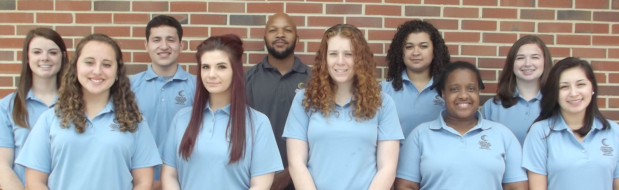 Click to enlarge,  Ten students have been named Student Ambassadors for the 2016-17 school year at Central Carolina Community College. Ambassadors are students who serve as official hosts of the college, representing it at college and community events both on- and off-campus. The 10 students who are serving as Ambassadors for the 2016-17 school year are pictured, left to right: front row, Lydia Cooper of Sanford, Carly Dube of Andover, Mass., Briana Peterman of Sanford, Tiffany Gee of Stone Mountain, Ga., and Ruvi Rodriguez Suarez of Robbins; back row, Courtney May of Apex, Noel Martinez of Sanford, Rasheed Jones of Goldston, Kyla Ross of Dunn, and Leslie Bridges of Sanford. Aaron Mabe is the Student Ambassadors Advisor. "These Ambassadors are the finest representatives Central Carolina Community College could have," said CCCC President T.E. Marchant. "I am proud of how they carry out their responsibilities, creating goodwill and respect for the College wherever they give presentations or serve. In addition, their experiences as Ambassadors instill within them qualities that will benefit them, their families, their employers, and their communities for the rest of their lives." 