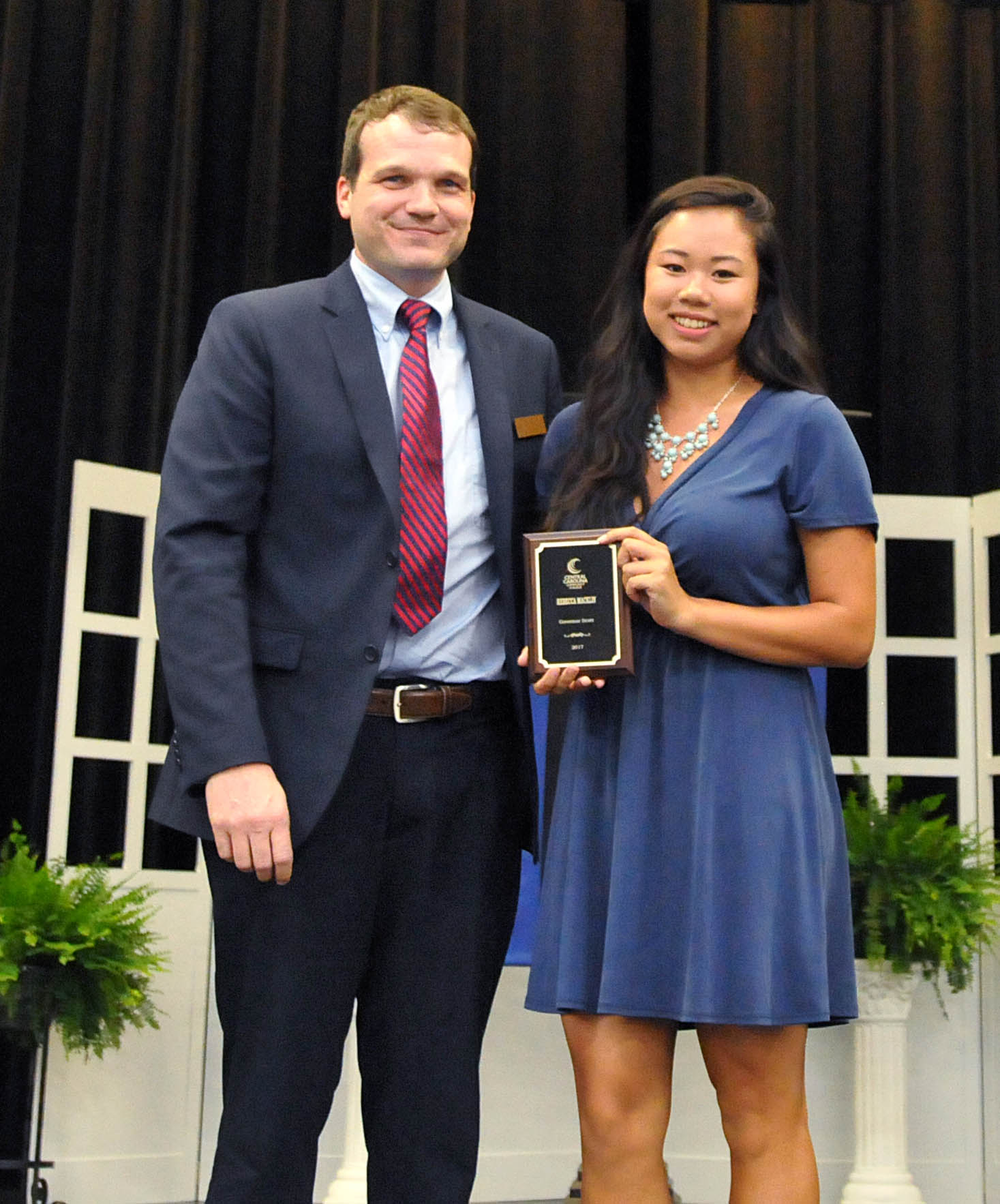 Click to enlarge,  Rebecca Macklin (right) is Central Carolina Community College's nominee for the N.C. Community College System's Gov. Robert Scott Award. Presenting the award to Blair is Mike Beck, CCCC Dean of Student Learning. 