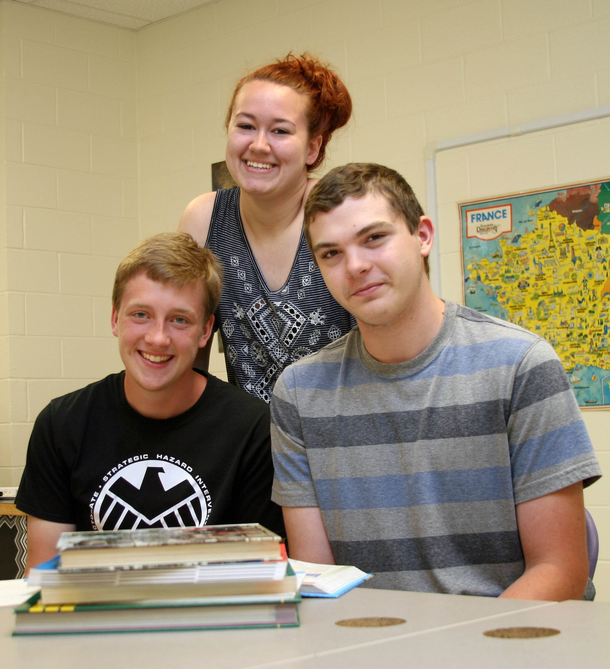Click to enlarge,  Chatham Charter students Jacob DeKaney (from left), Allyson Everage and Tylor Atkins say taking so many college courses in high school is a challenge, but one that prepares them for a successful future. 