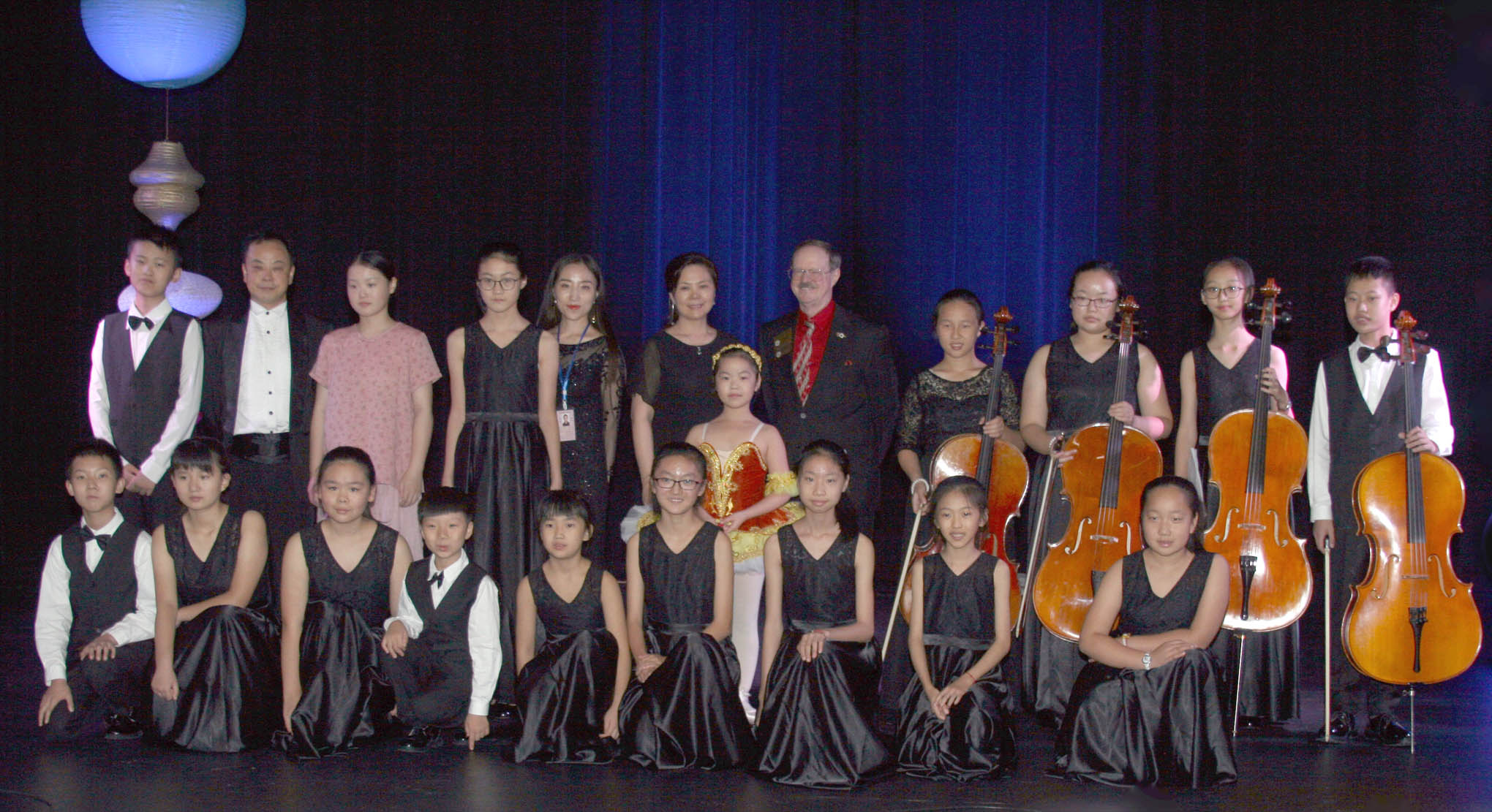 Click to enlarge,  Sanford Mayor Pro Tem Sam Gaskins (center, back row) is pictured with members of the Xiangyang Youth Philharmonic Orchestra. 
