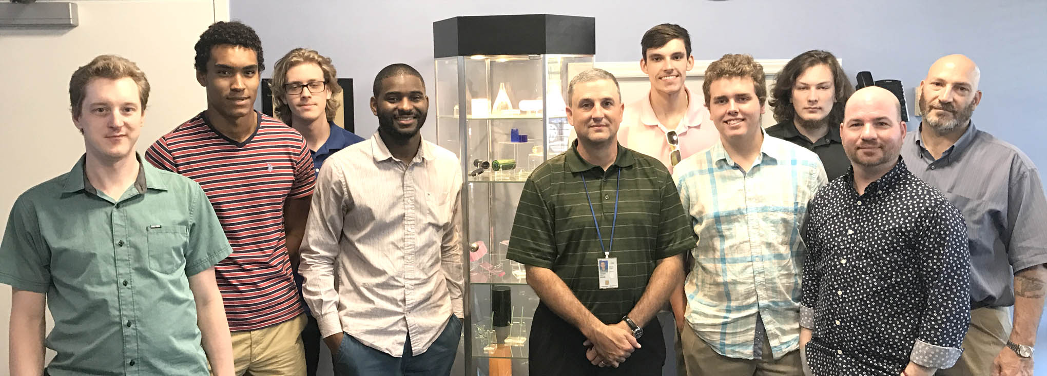 Click to enlarge,  Touring Synoptics, a division of Northrop Grumman, were, left to right: Michael Kropp, Brandon Pasley Disher, Seth Kuenzler, Jamal Robinson, Dr. Kevin Stevens (Director of Research &amp; Development at Synoptics, who is also an advisor to the CCCC LPT program), Cody Flowers, Derrick Kuhl, Darin Anderson, Nickolas Jorgenson, and Richard Dickens. 