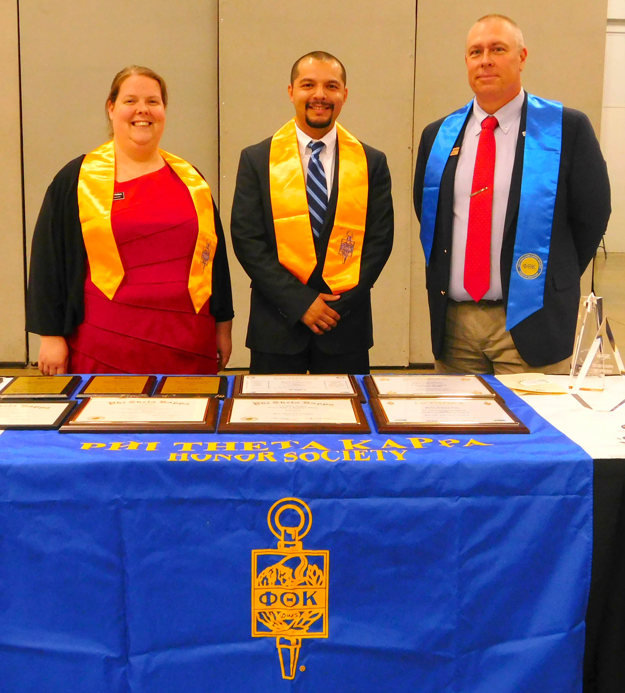 Click to enlarge,  Rogelio Salvador (center), Phi Theta Kappa Alumnus, was the speaker for the Central Carolina Community College Phi Theta Kappa International Honor Society spring induction ceremony. Pictured with Salvador are CCCC PTK Chapter Advisors Becky Finken (left) and Dr. Rodney Powell (right). 