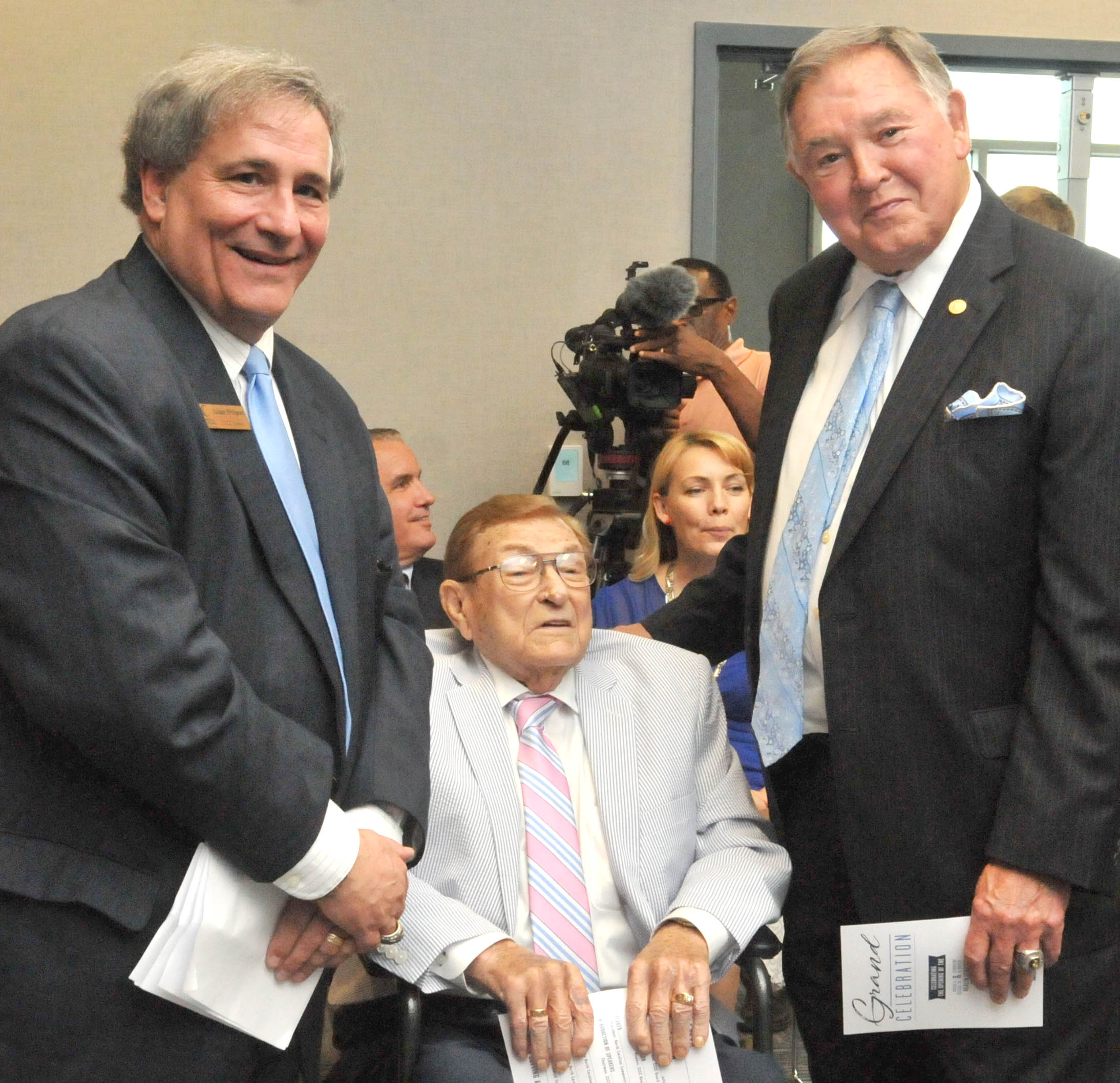 Click to enlarge,  Oscar A. Keller Jr. (center) visits with Julian Philpott (left), Chairman of the Central Carolina Community College Board of Trustees, and former N.C. Secretary of State and Attorney General Rufus Edmisten (right) at the CCCC Grand Celebration. 