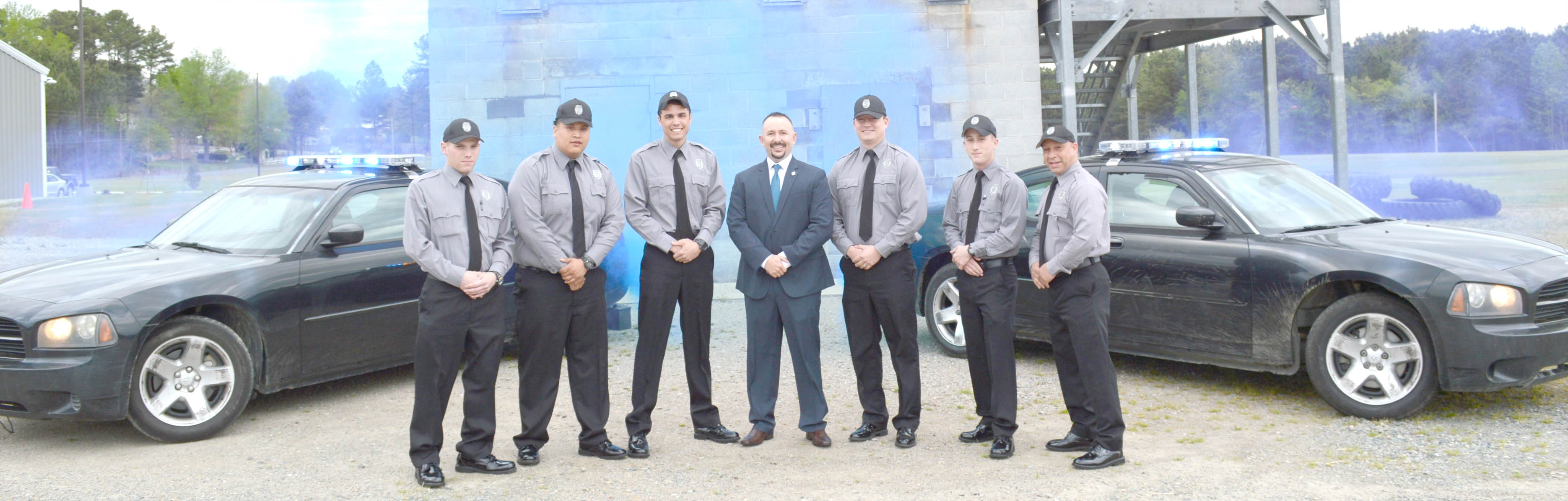 Click to enlarge,  Pictured are members of Central Carolina Community College's Basic Law Enforcement Training (BLET) graduating class -- Bryan Andersen, Roberto Flores, Benjamin Nuckols, Capt. Brian Estes of the Lee County Sheriff's Office, Patrick McKinnon, Grant Connick, and Osiris Pena. For more information about the college's BLET program, visit www.cccc.edu/blet or contact Robert Powell at rpowell@cccc.edu or 919-777-7774. 