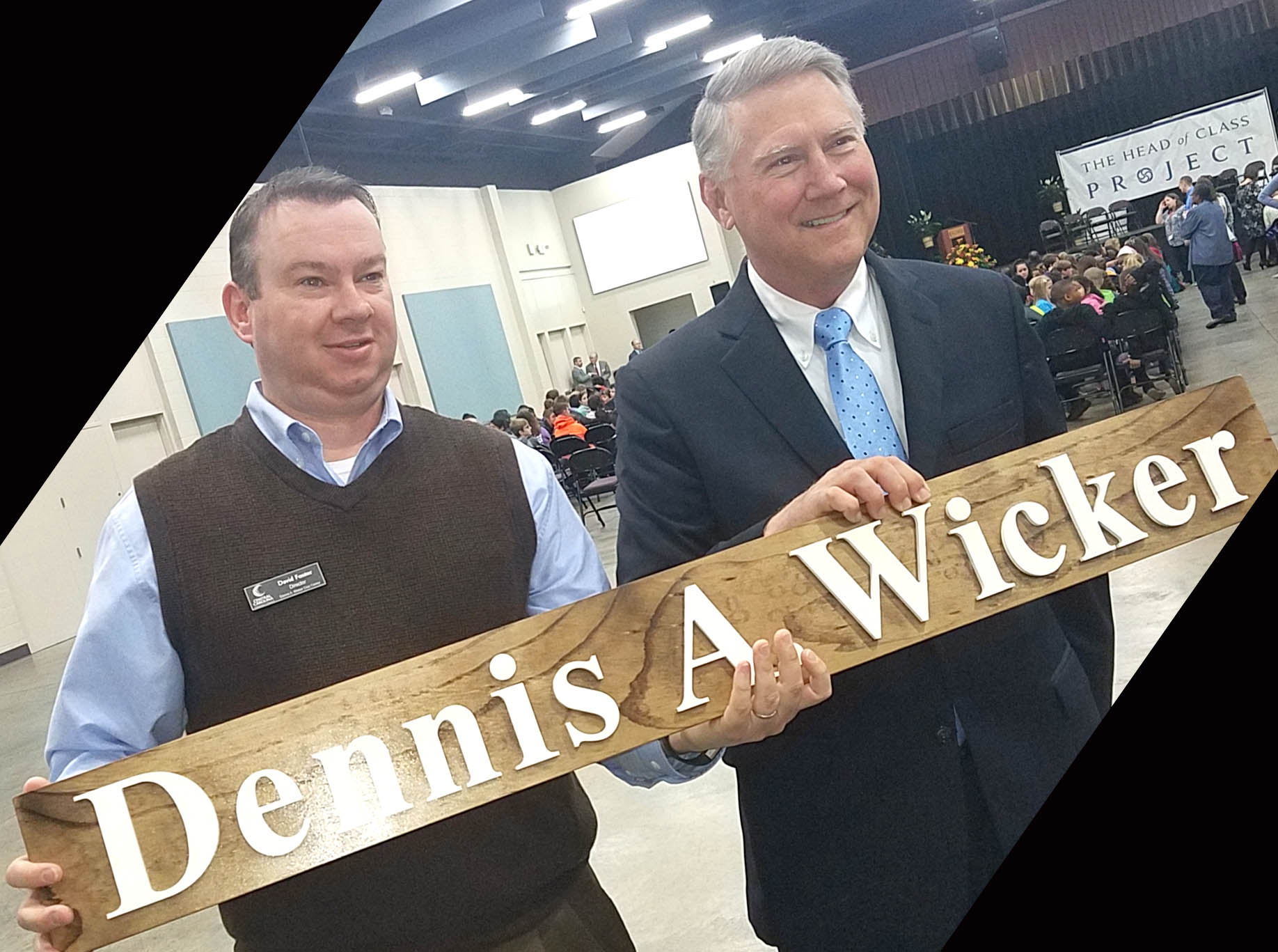 Click to enlarge,  The staff of the Dennis A. Wicker Civic and Conference Center in Sanford recently presented former N.C. Lt. Gov. Dennis A. Wicker (right) with the original mounted letters from the original road entry sign of the Dennis A. Wicker Civic Center, located at the corner of Kelly Drive and Nash Street in Sanford. At left is David Foster, who is Director of the Civic Center. Rebranded in 2018, the Dennis A. Wicker Civic and Conference Center new lettering will appear on the entry sign. The staff made the presentation as a token of appreciation for Lt. Gov. Wicker's support.  