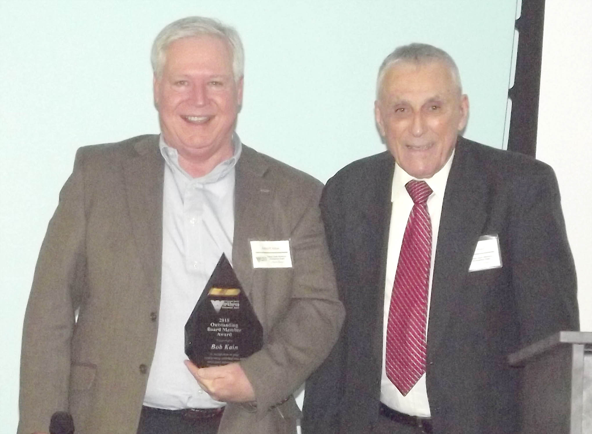Click to enlarge,  Bob Kain, of Lee County, received the Outstanding Board Member Award at the 7th Annual Triangle South Workforce Development Board (TSWDB) Awards Banquet held Wednesday, Dec. 5, at the Central Carolina Community College Harnett Health Sciences Center in Lillington. Presenting the award was Russell Hieb, TSWDB Chairman. 