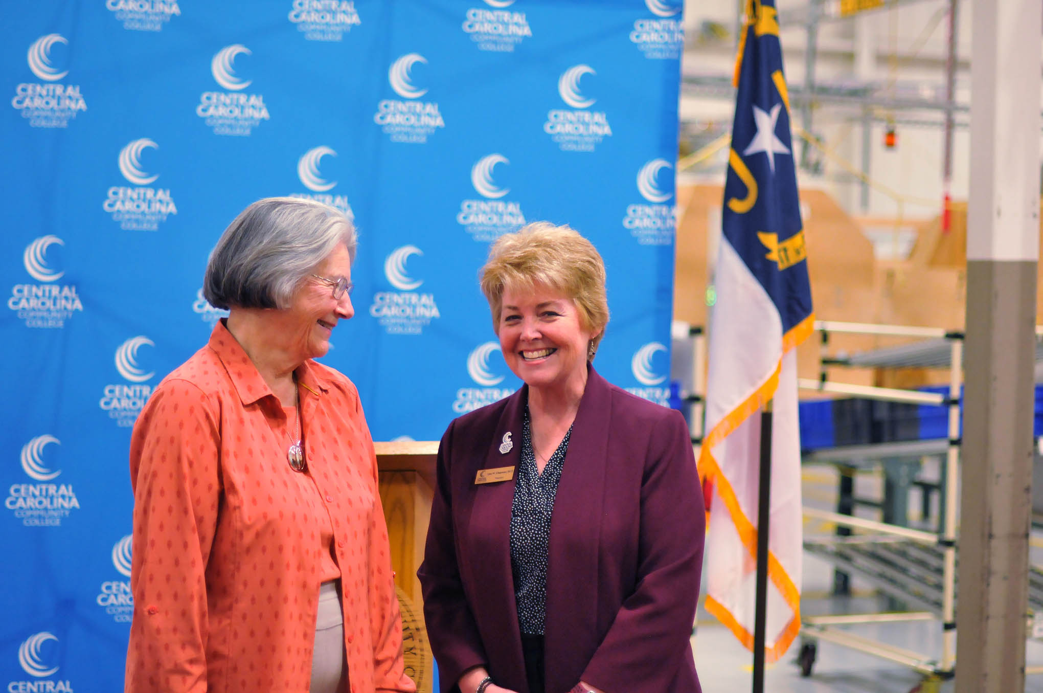Click to enlarge,  Central Carolina Community College President Dr. Lisa M. Chapman (right) shares a moment with Dr. Barbara James. CCCC's Howard-James Industry Training Center is named for Dr. James and her late husband, Dr. Paul Howard. 