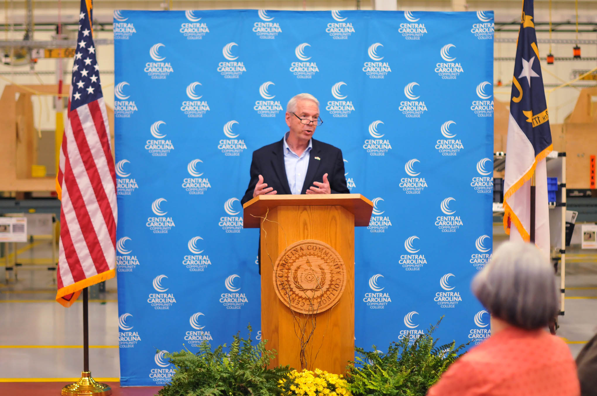 Click to enlarge,  Bob Joyce, Director of Development for the Sanford Area Growth Alliance, speaks at the Central Carolina Community College 10,000 hours of industrial training celebration event. 