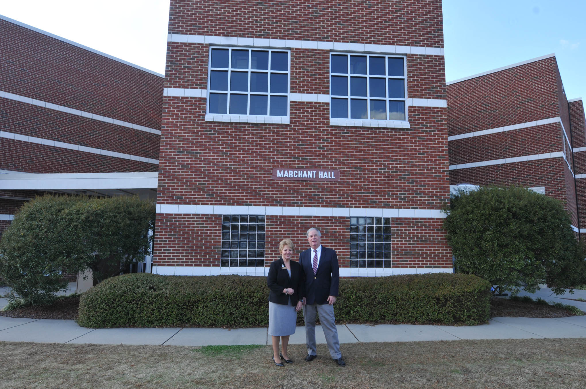 Click to enlarge,  Dr. T. Eston "Bud" Marchant (right) is pictured with current Central Carolina Community College President Dr. Lisa M. Chapman in front of Marchant Hall on the CCCC Lee Main Campus in Sanford, N.C. 