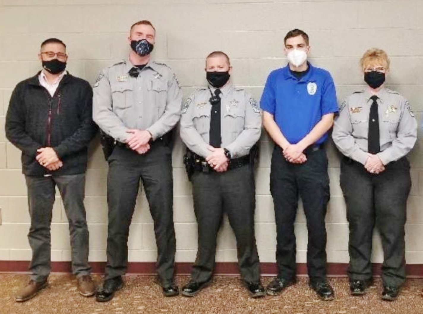 Click to enlarge,  Three individuals have been recognized as the most recent graduates of the Central Carolina Community College Basic Law Enforcement Training program. Pictured are, left to right: CCCC BLET Director Neil Ambrose, Joshua Sammons, Alex Lukasewycz, Connor Brogan, and Captain Tammy Kirkman of the Chatham County Sheriff's Office. 